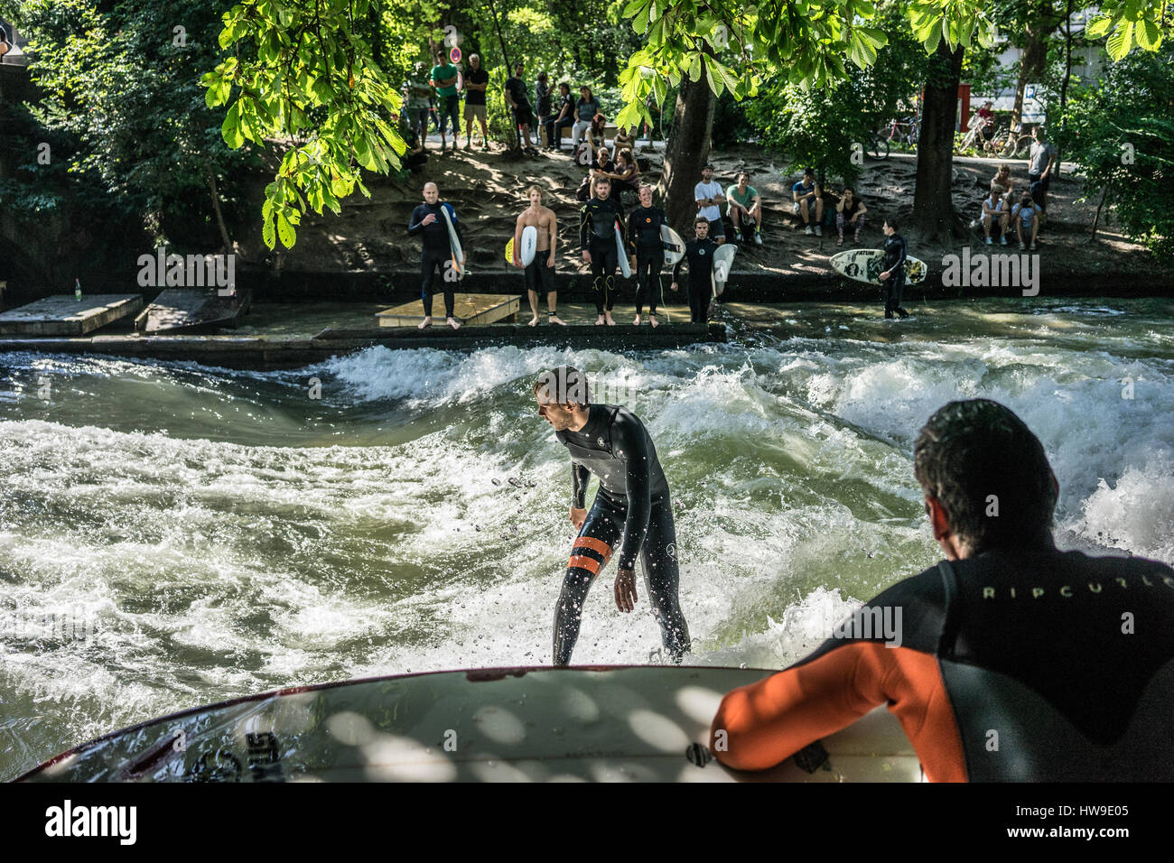 Surfing the Eisbach river in Englischer Garten, Munich, Germany Stock