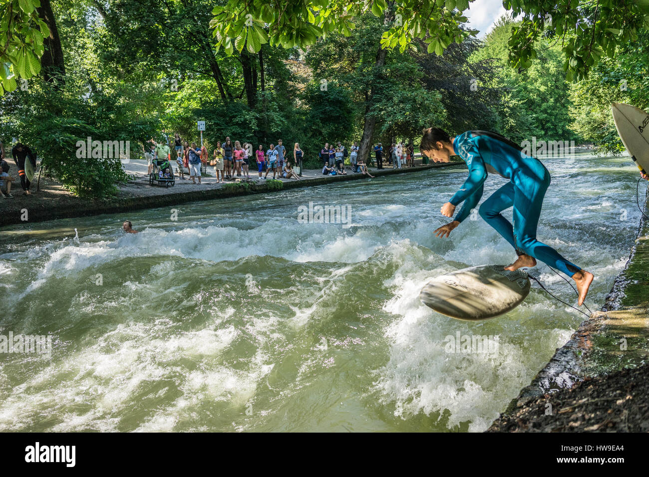 Surfing the Eisbach river in Englischer Garten, Munich, Germany Stock Photo