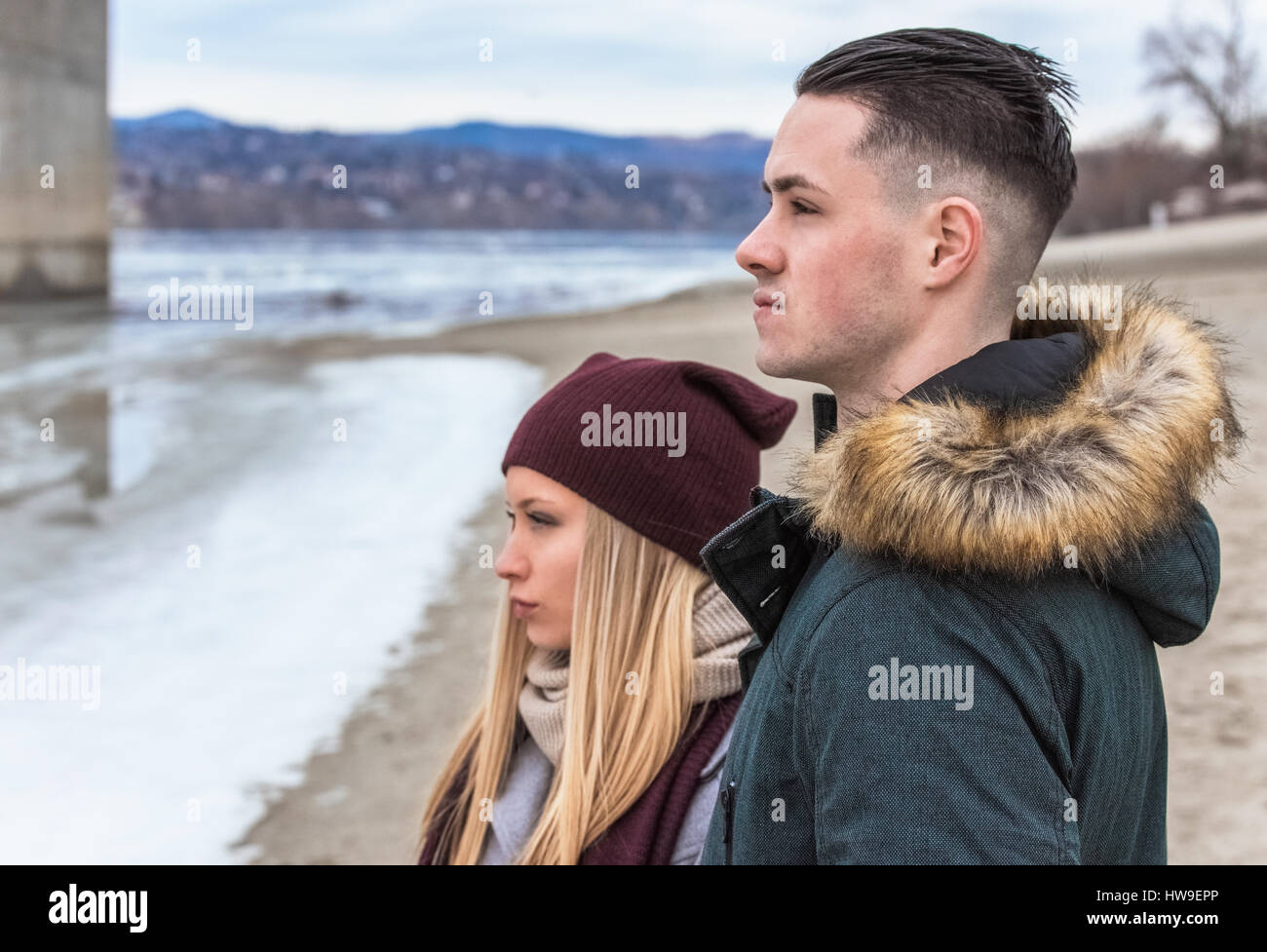 Young serious couple profile view Stock Photo