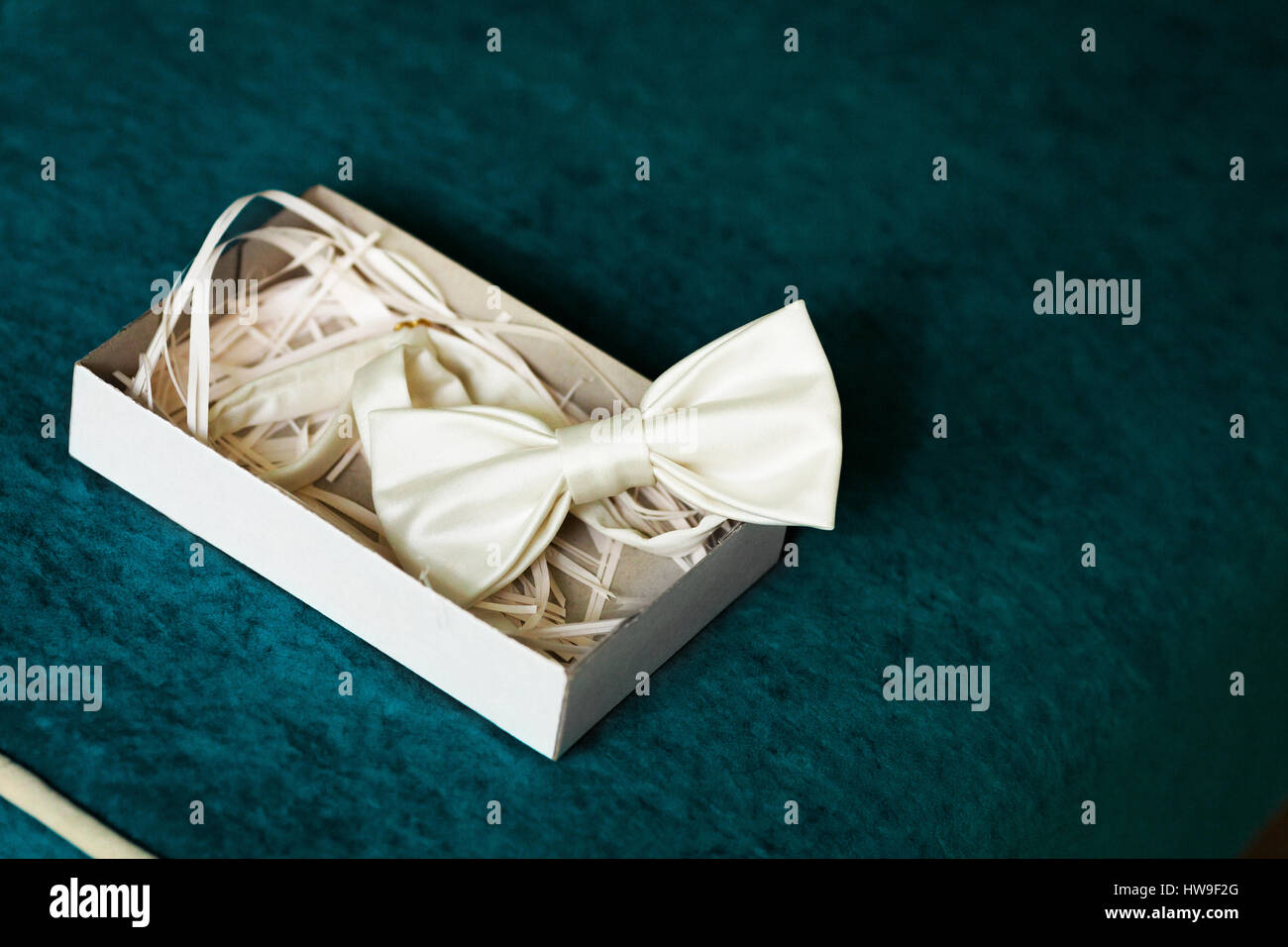 Luxury silk bow-tie in decorated box on dark background Stock Photo
