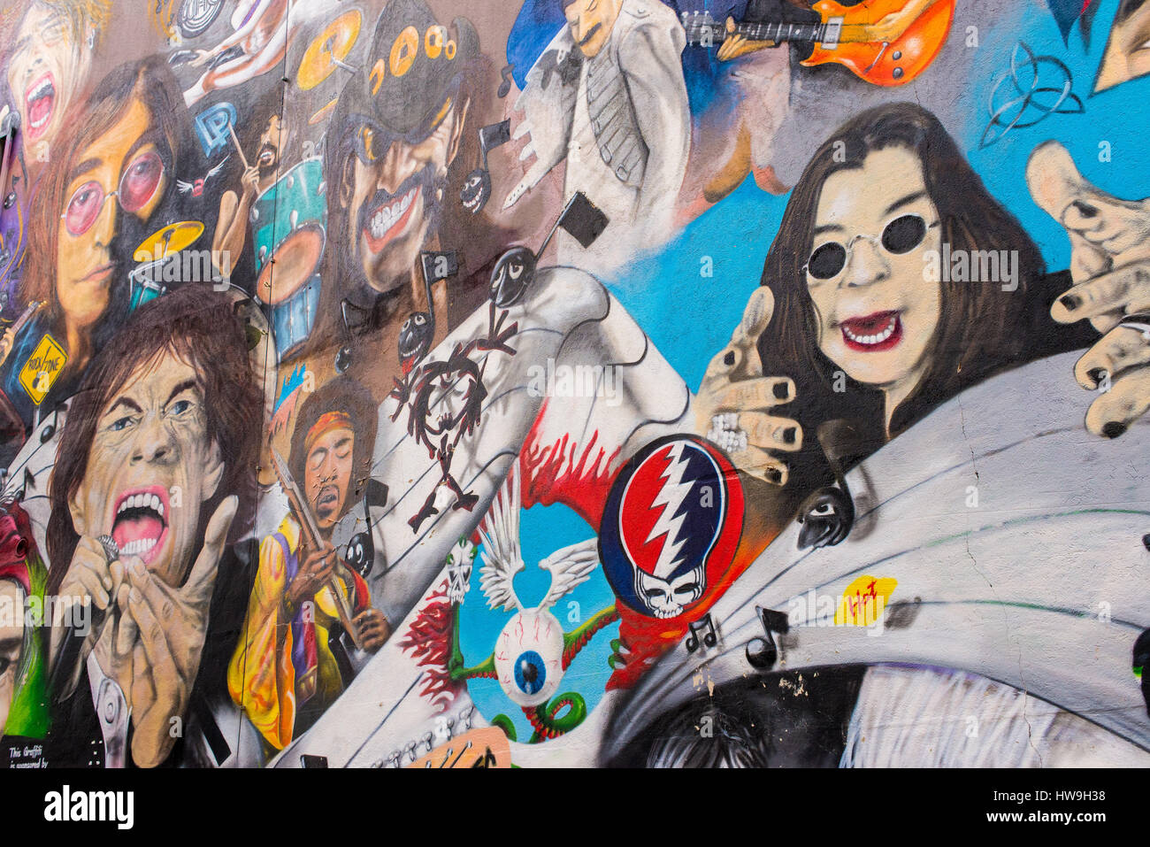 The wall shows portraits of rock stars like Janis Joplin, Keith Richard, Mick Jagger, Morrison and the Doors, Jimy Hendrix, The Who, Pearl Jam, Dave G Stock Photo