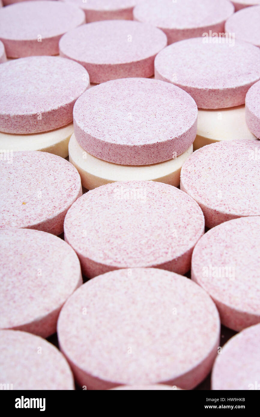 Stack of vitamin mineral supplement effervescent tablets pattern texture. Multivitamin supplement tablet. Soluble Vitamin. Fizzy tablet. Stock Photo