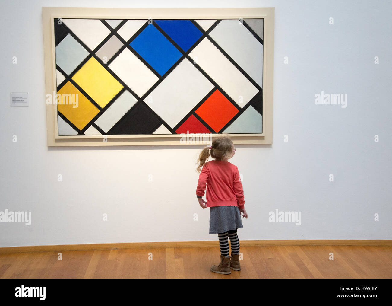 small  visitor at painting 'contra-composition XVl' by theo van doesburg Stock Photo