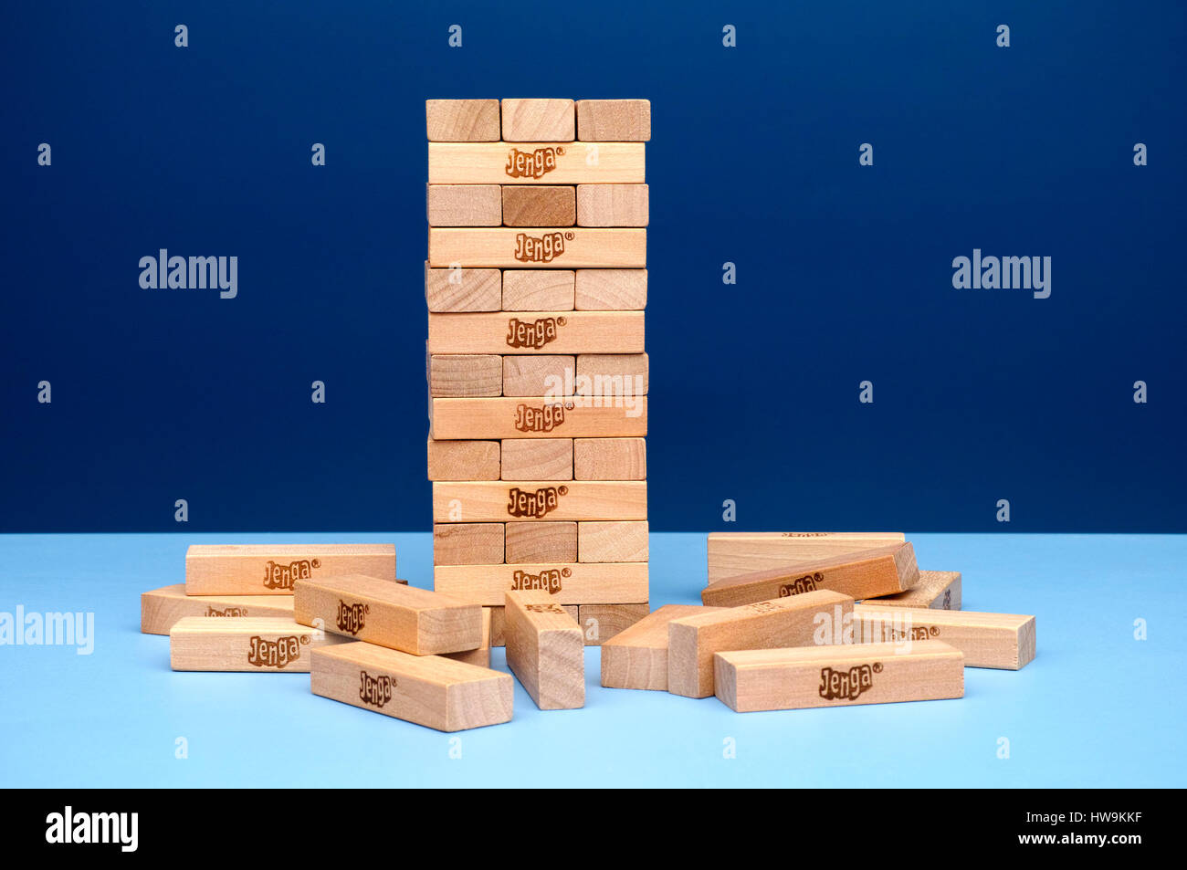 Tambov, Russian Federation - March 03, 2016 Jenga tower constructed and some Jenga blocks with blue background. Studio shot. Stock Photo