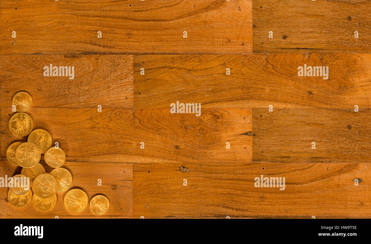 Old wooden planks with gold coins background Stock Photo