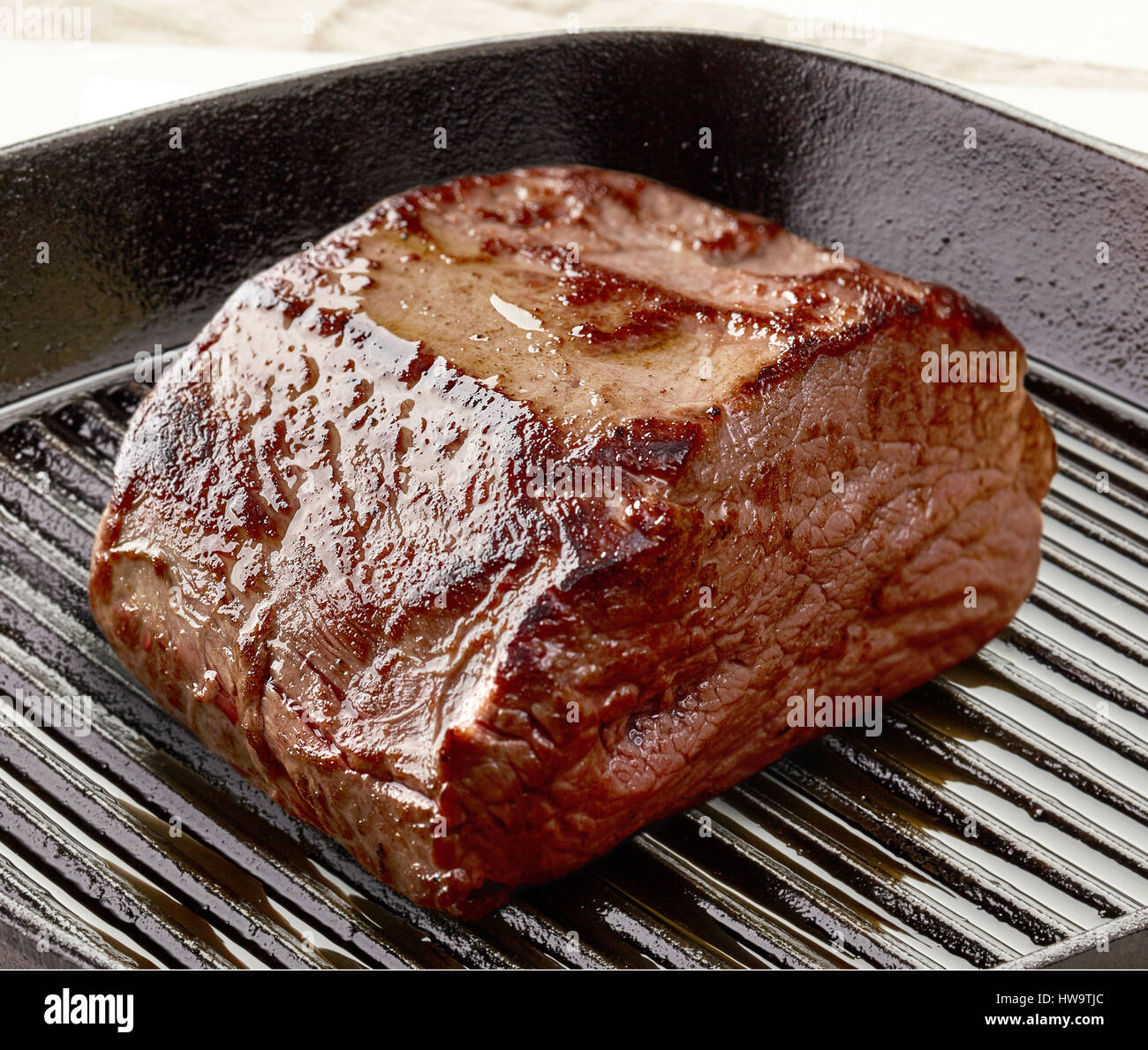 Deer meat steak on frying pan Stock Photo Alamy