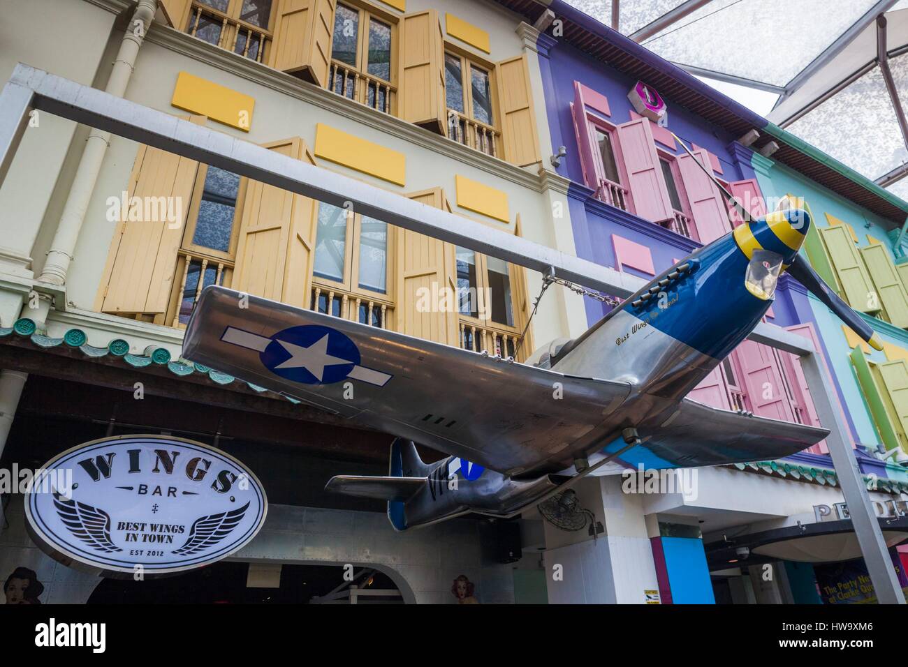 Singapore, Clarke Quay, entertainment district, Wings Bar with model of P-51 Mustang, WW2 aircraft Stock Photo