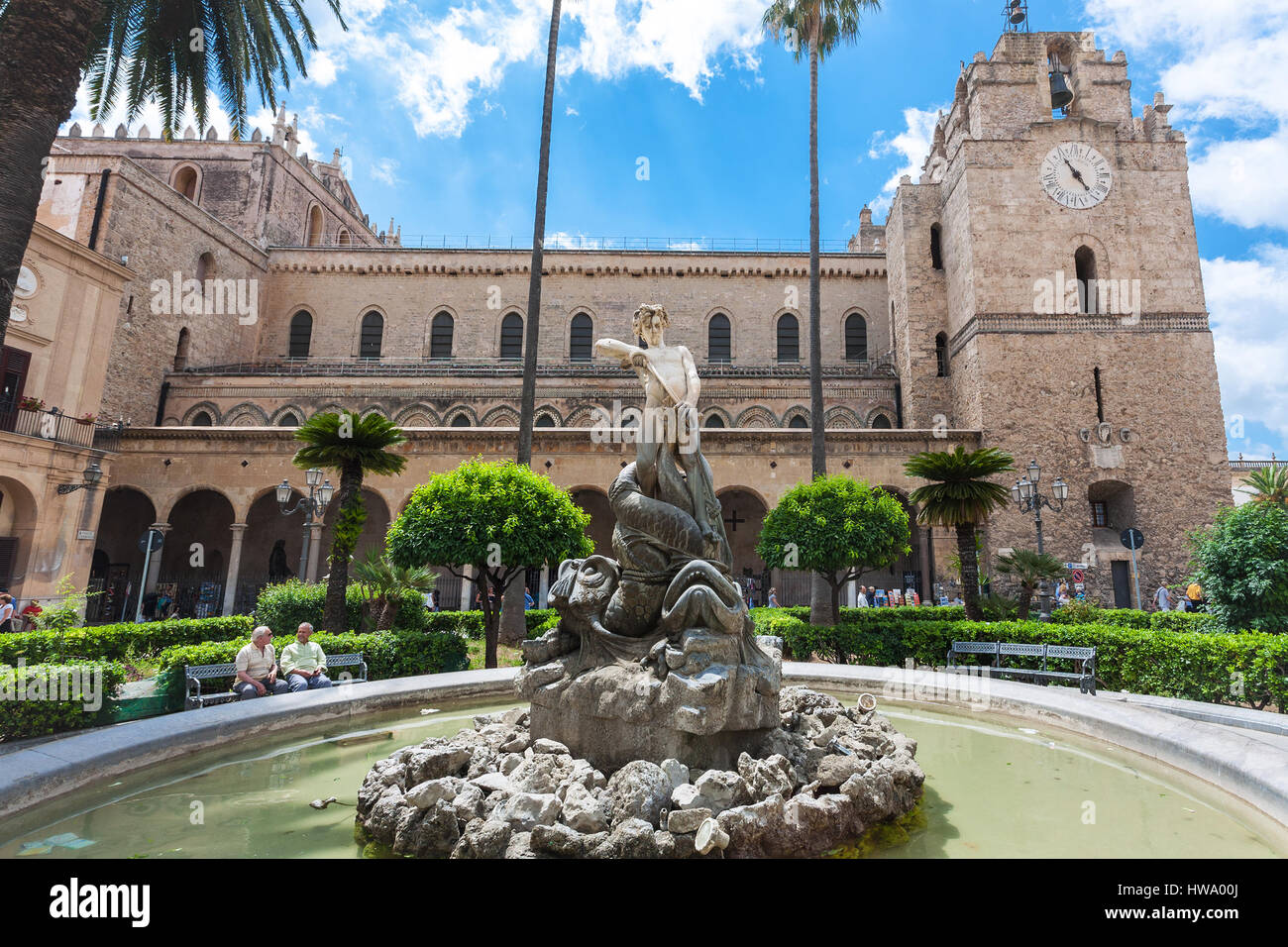MONREALE, ITALY - JUNE 25, 2011: people and fountain near Duomo in Monreale town in Sicily. The cathedral of Monreale is one of the greatest examples  Stock Photo