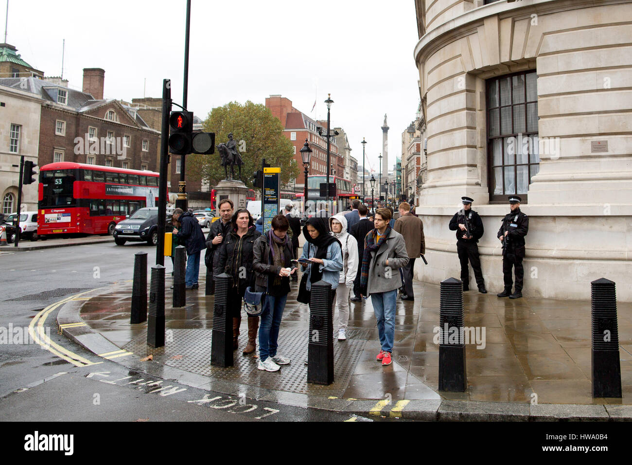 Armed police officers stand on guard in Westminster, London, UK. 29OCT14. Stock Photo