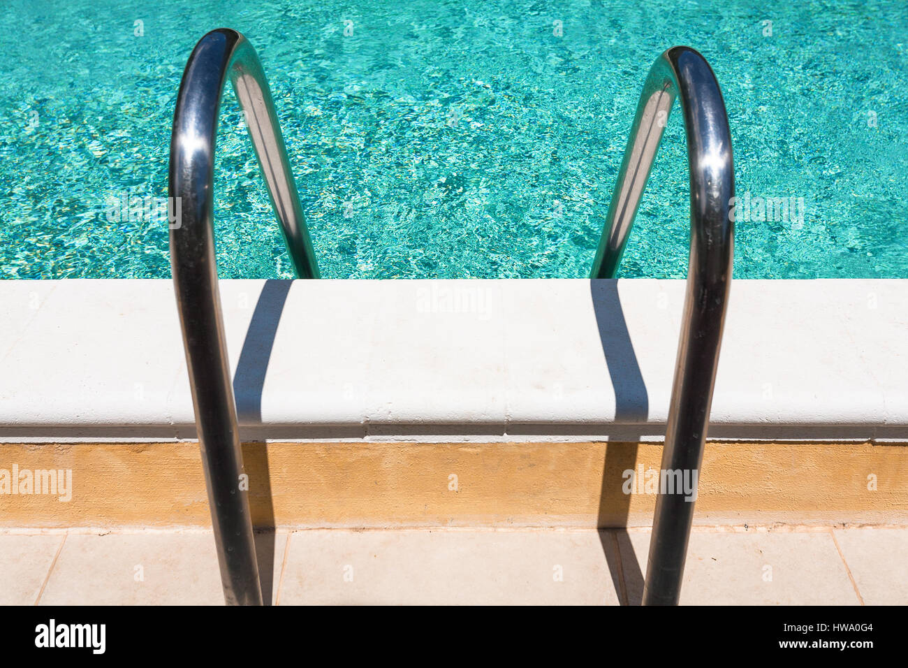 metal handles of outdoor swimming pool Stock Photo