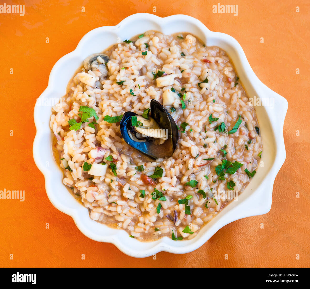 travel to Italy, italian cuisine - top view of Risotto al mare on plate in Sicily Stock Photo