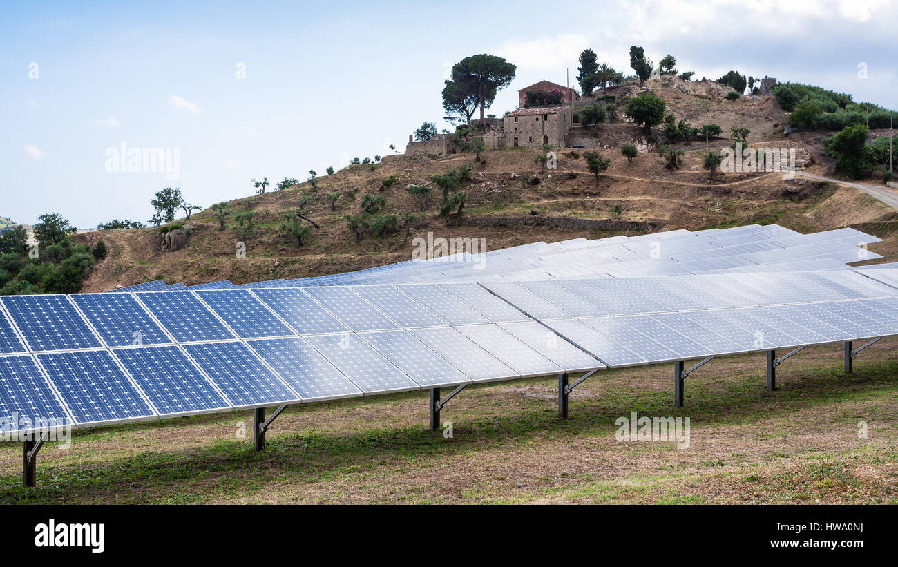 travel to Italy - solar batteries near village in Sicily Stock Photo