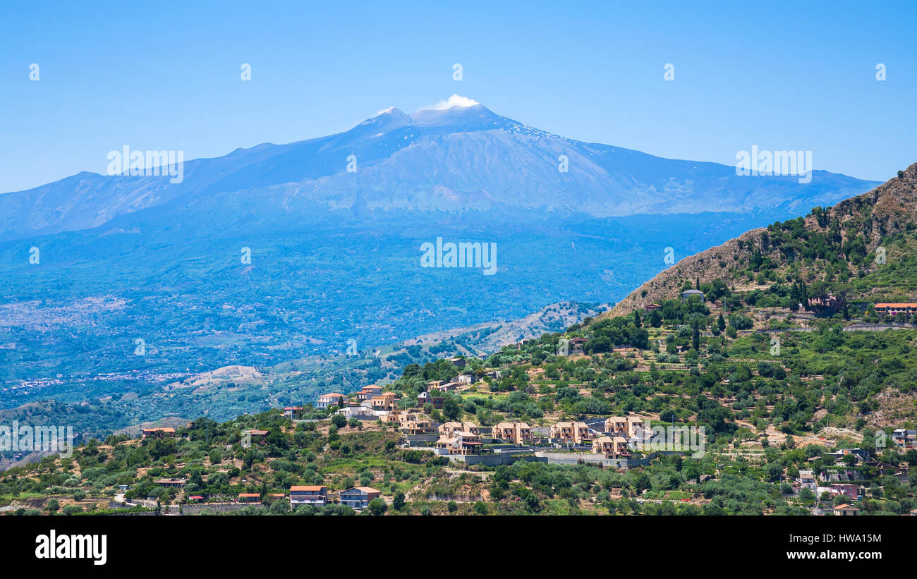 travel to Italy - view of villages and Etna volcano in Sicily Stock Photo