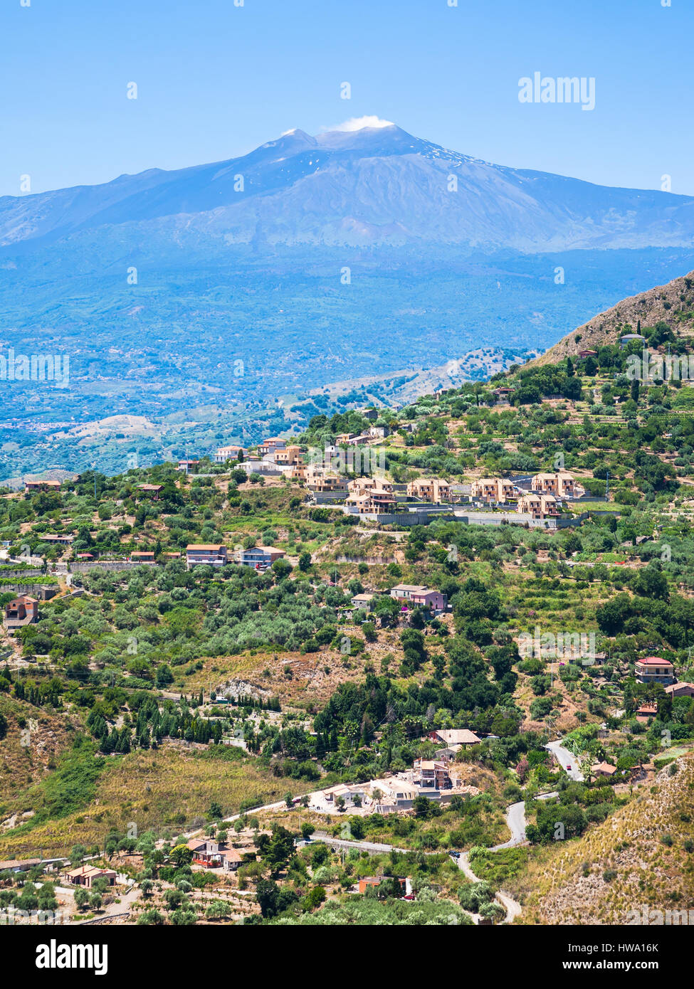 travel to Italy - view of green countryside and Etna volcano in Sicily Stock Photo