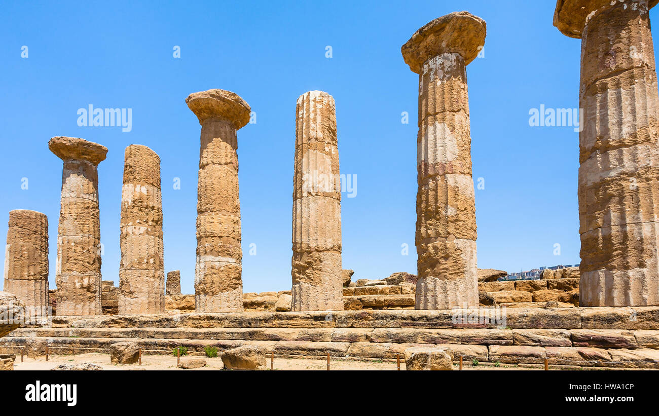 travel to Italy - Dorian columns of ancient Temple of Heracles (Tempio di eracle) in Valley of the Temples in Agrigento, Sicily Stock Photo