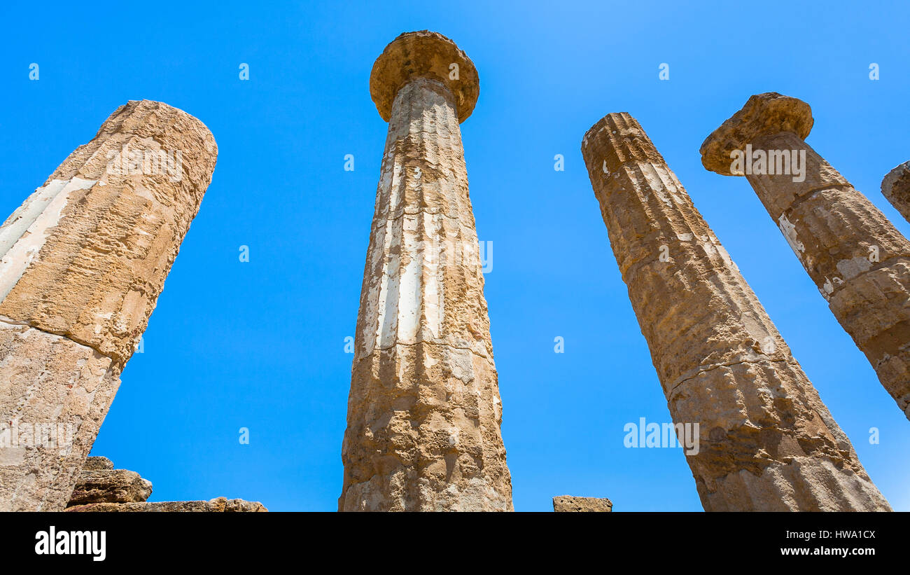 travel to Italy - blue sky and Dorian columns of ancient Temple of Heracles (Tempio di eracle) in Valley of the Temples in Agrigento, Sicily Stock Photo