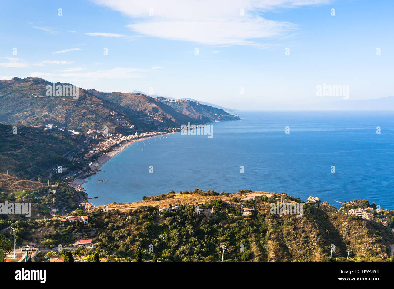 travel to Italy - view of Letojanni resort and coast of Ionian sea from Taormina city in Sicily in summer twilight Stock Photo