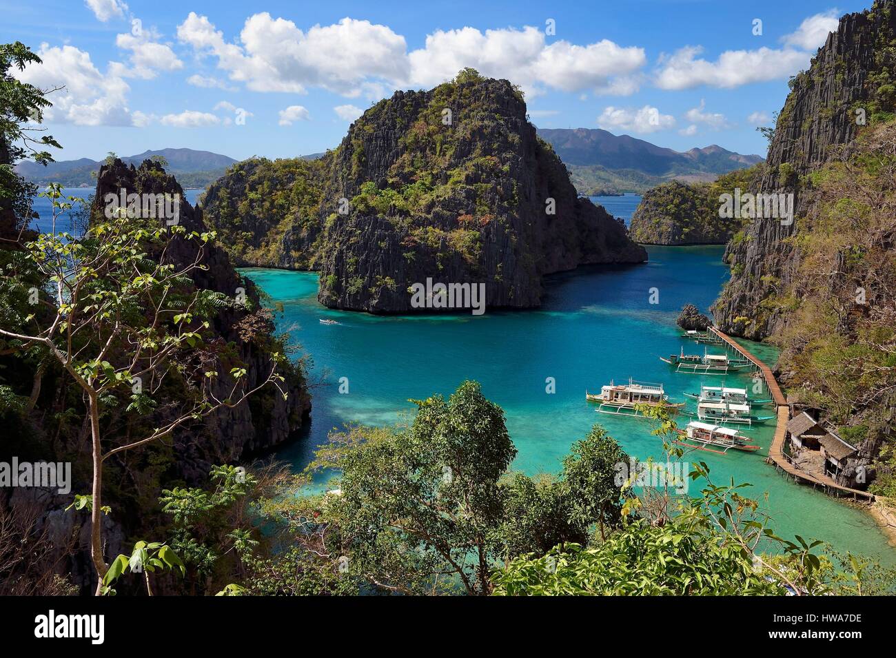 Philippines, Calamian Islands in northern Palawan, Coron Island Natural Biotic Area, lagoon on the way to Kayangan Lake, steep cliffs and Karst rock f Stock Photo