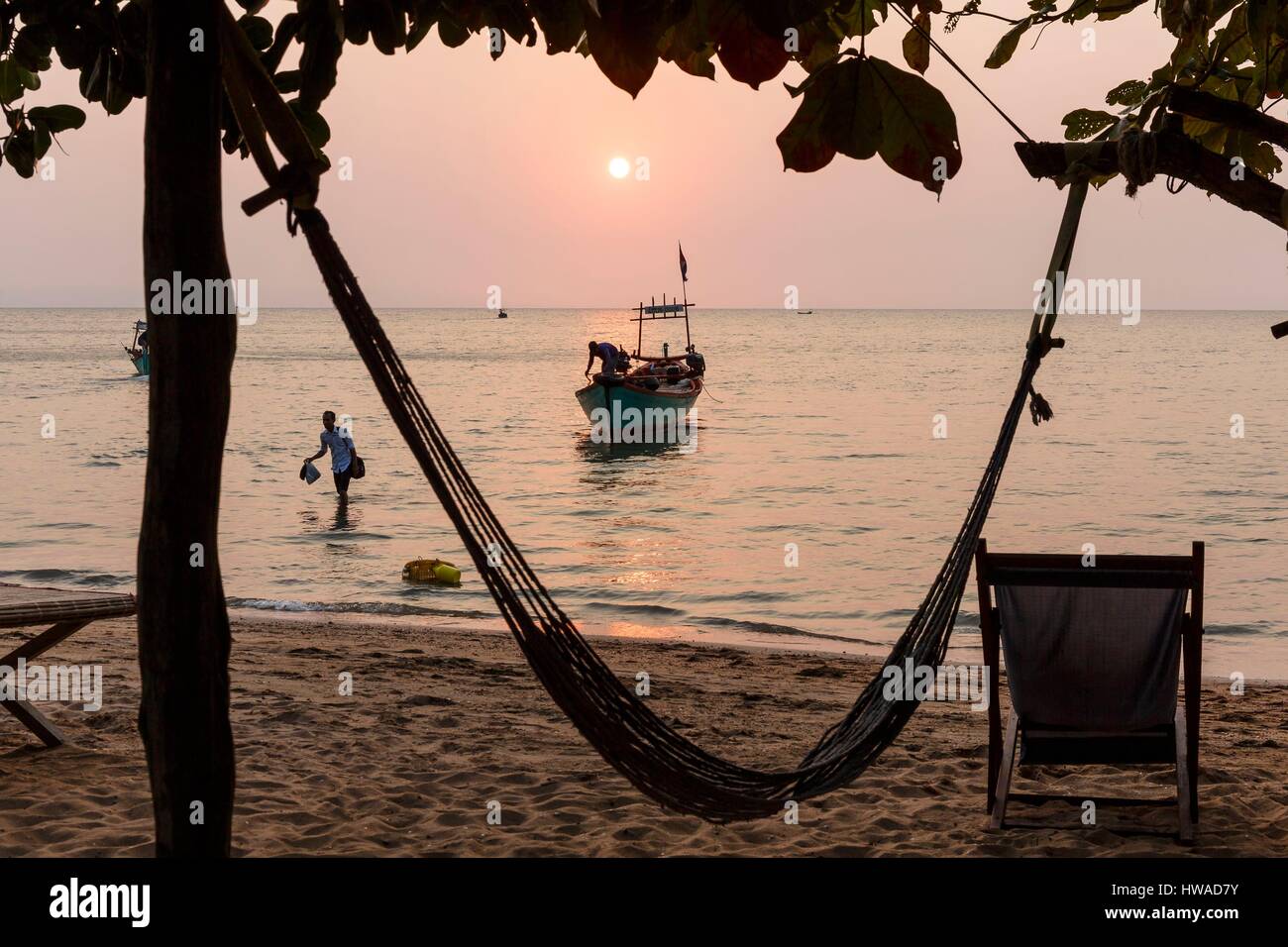 Cambodia, Kep province, Koh Tonsay island or rabbit isalnd, sunset on the beach, boat and hammock Stock Photo