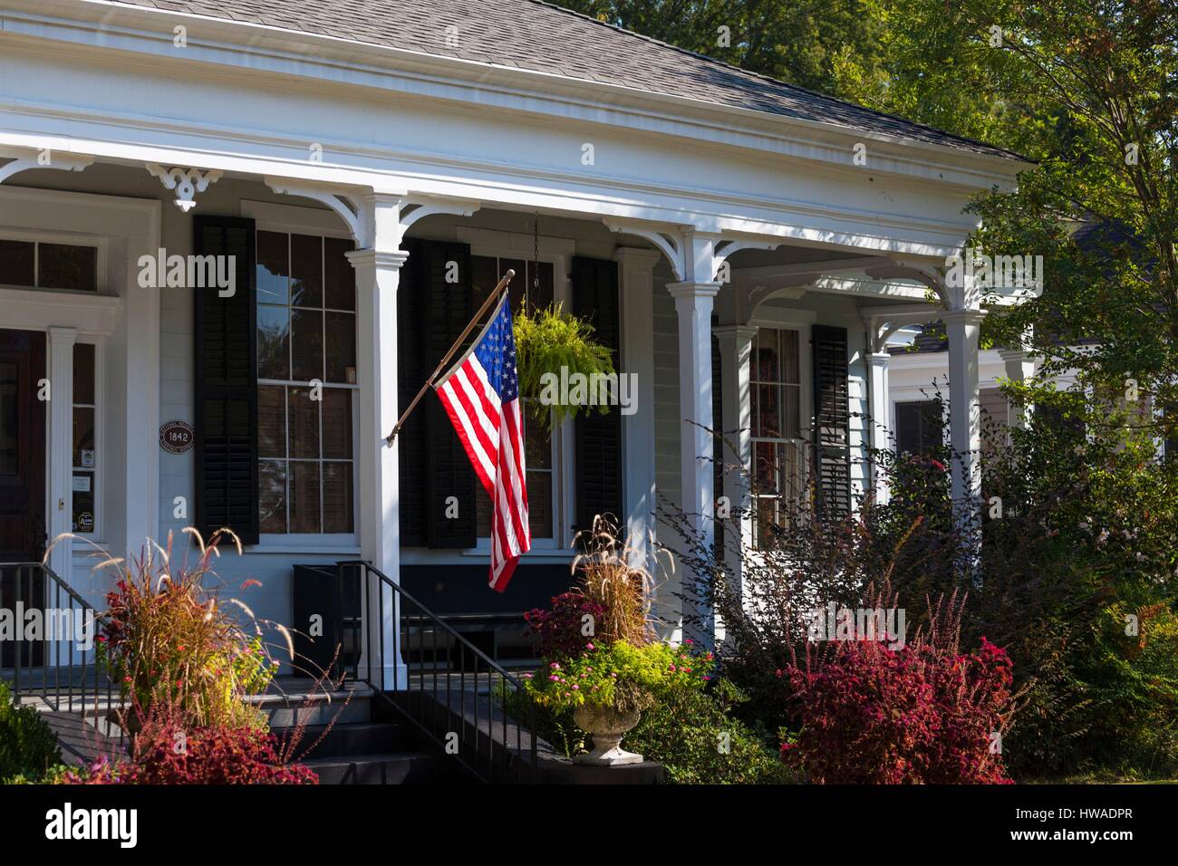 United States, Georgia, Columbus, old town house with US flag Stock Photo