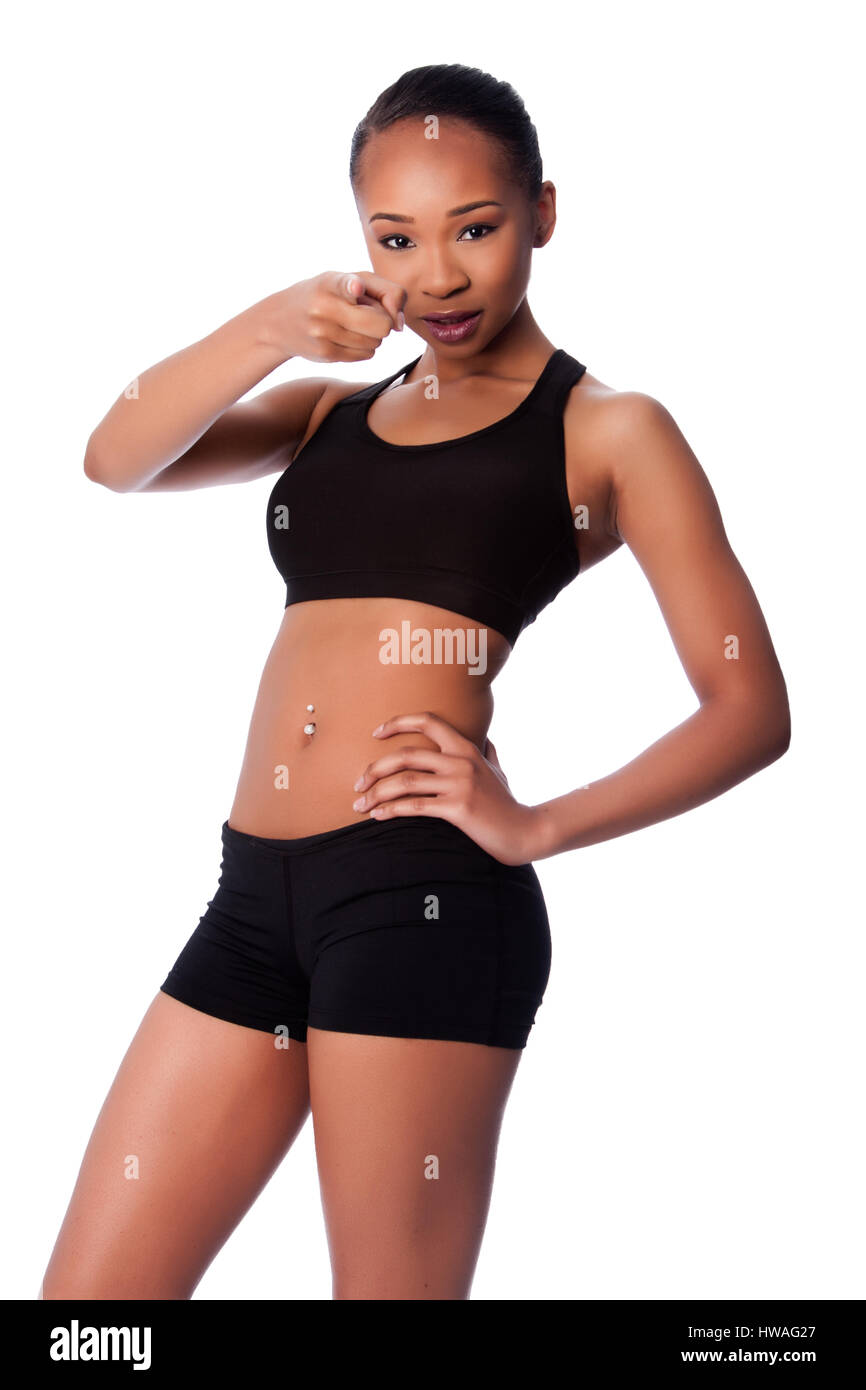 Beautiful healthy fit happy smiling black asian woman workout and toned body, pointing finger. Stock Photo