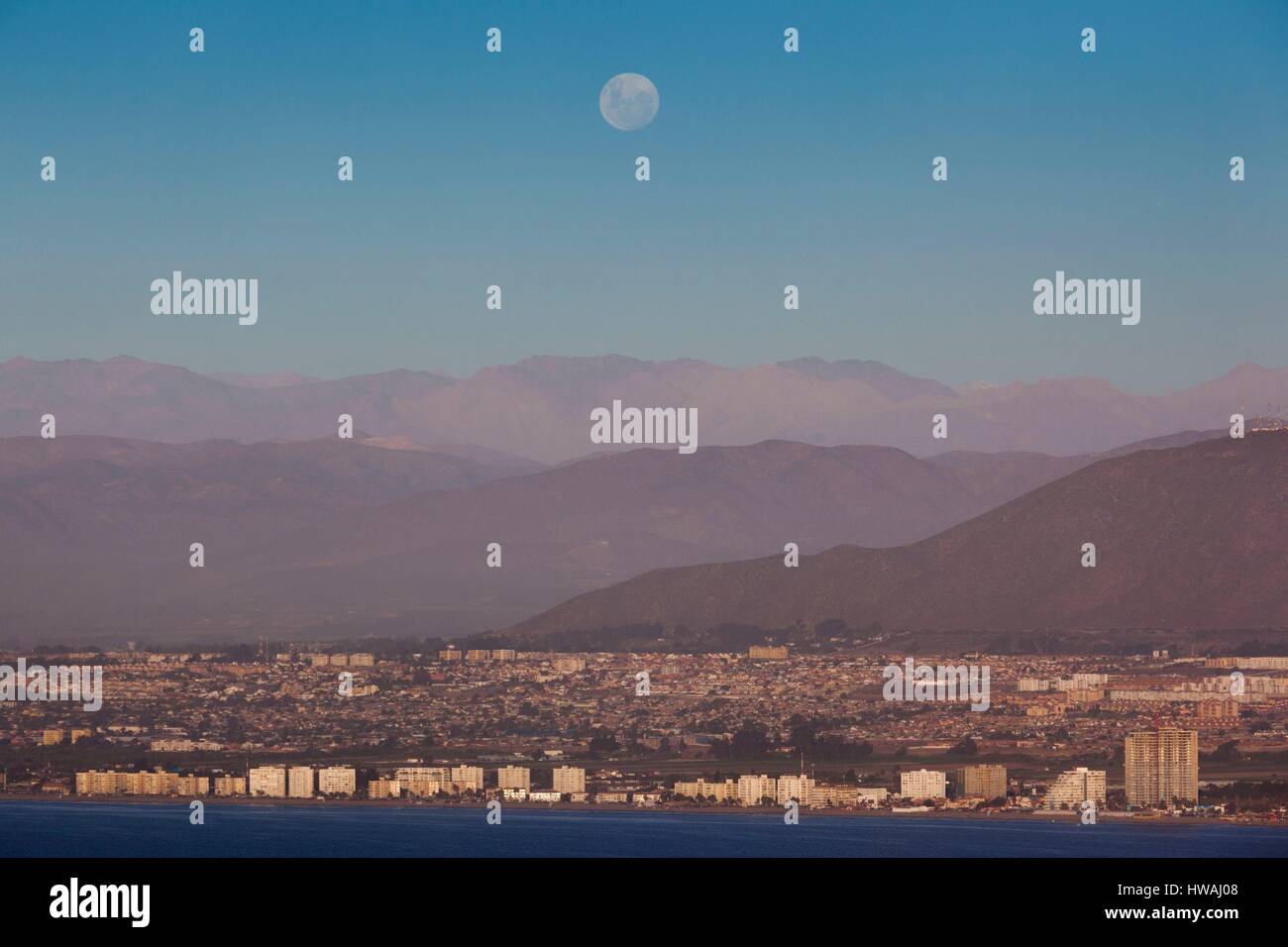 Chile, Coquimbo, elevated city view of La Serena from the Cruz del III Milenio cross, dusk with moonrise Stock Photo