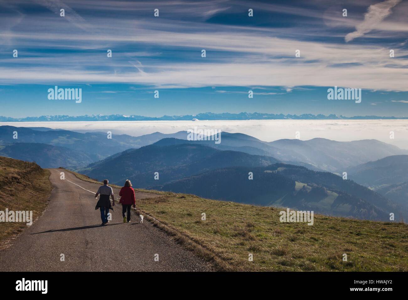 Germany, Baden-Wurttemburg, Black Forest, Belchen Mountain, summit view towards the Alps with people Stock Photo