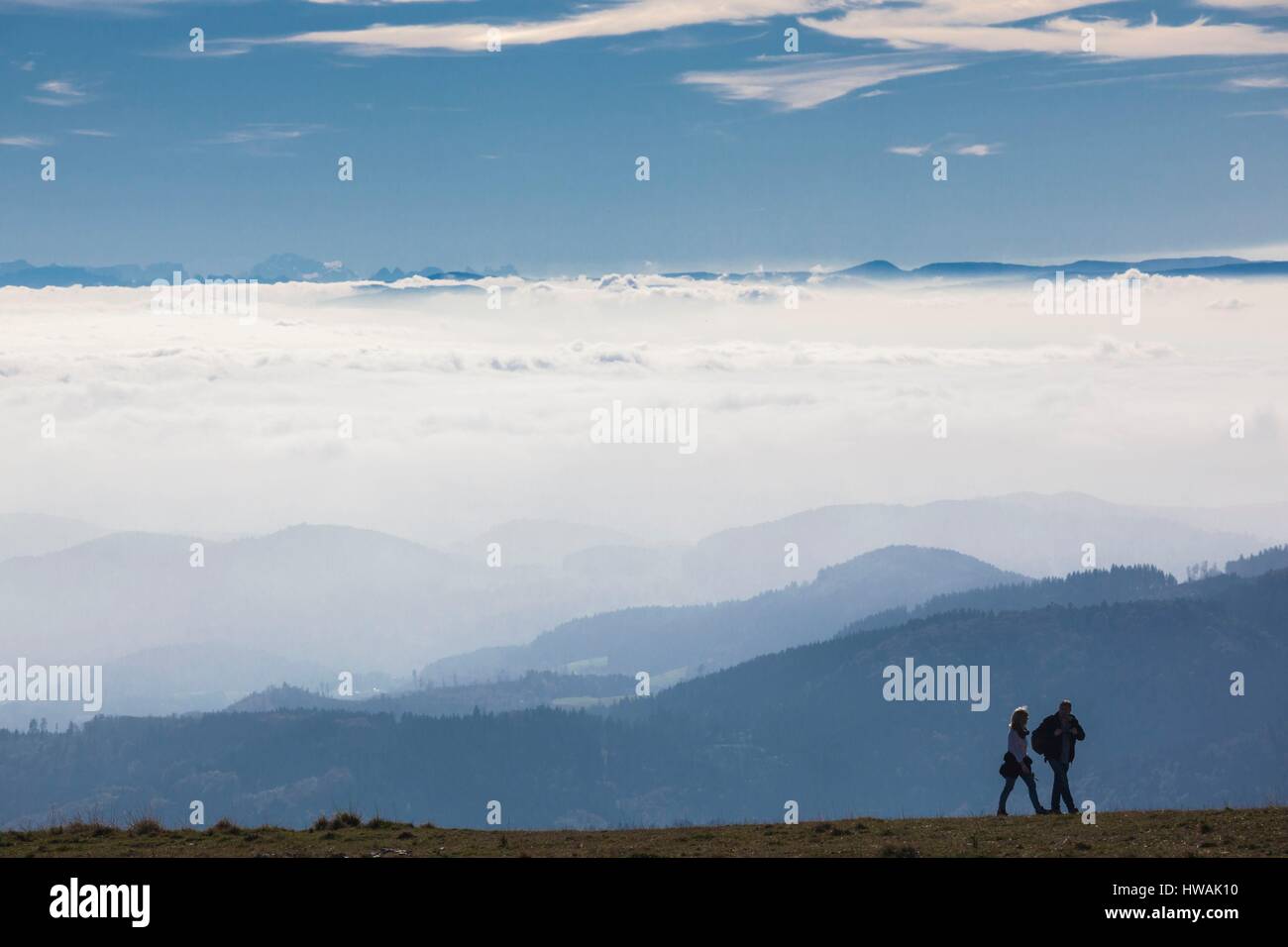 Germany, Baden-Wurttemburg, Black Forest, Belchen Mountain, summit view towards the Alps with people Stock Photo