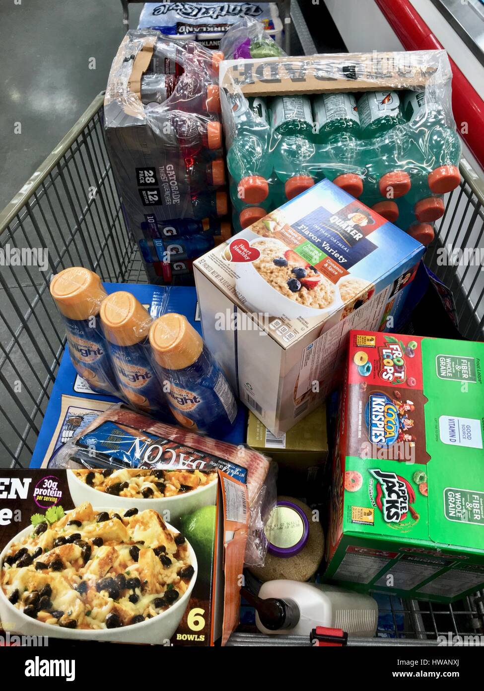 Grocery cart filled with groceries at Costco Stock Photo