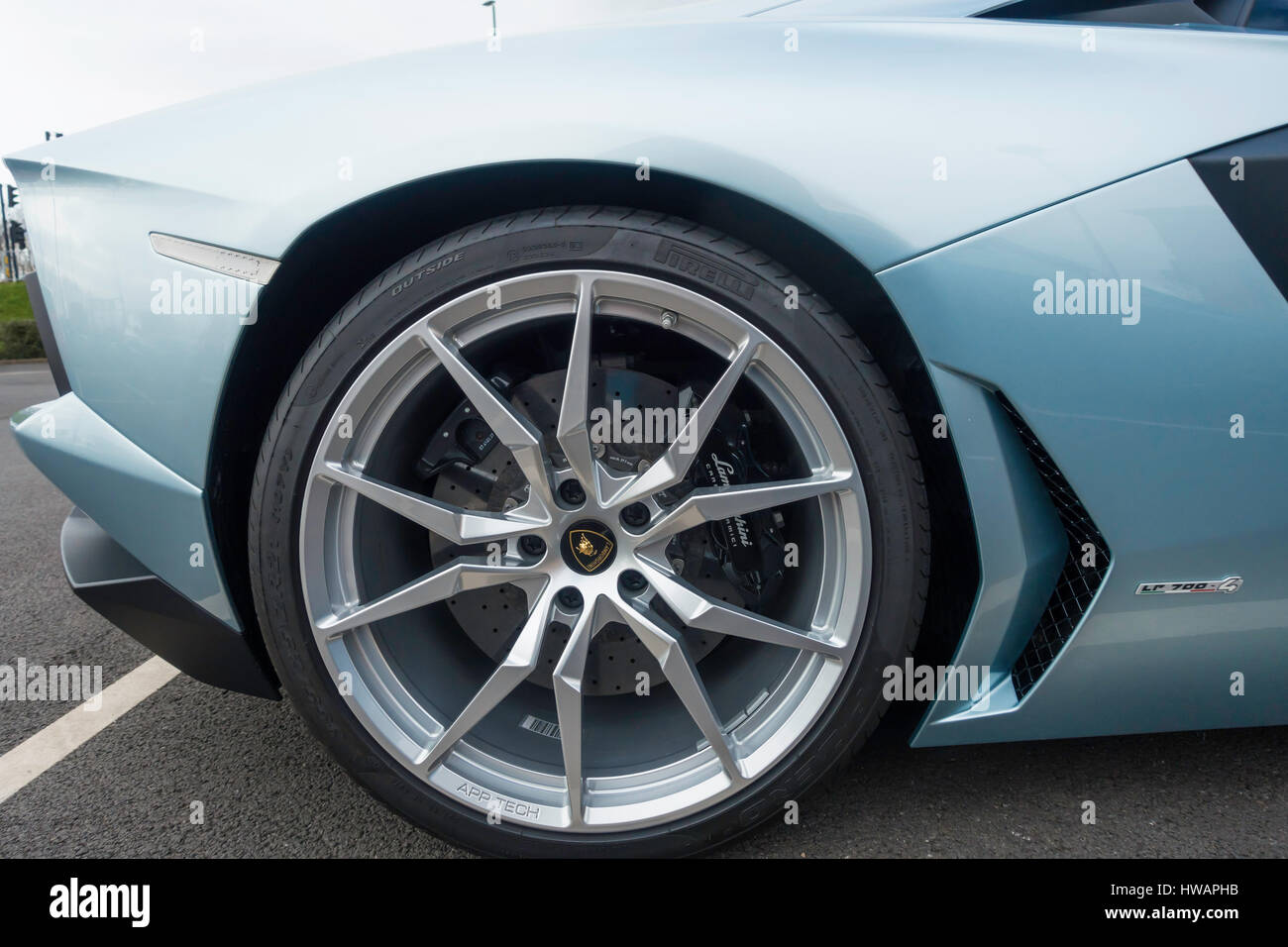 Lamborghini LR-700-4 Sports car detail showing ten spoked alloy wheel and disc brake calipers. Stock Photo