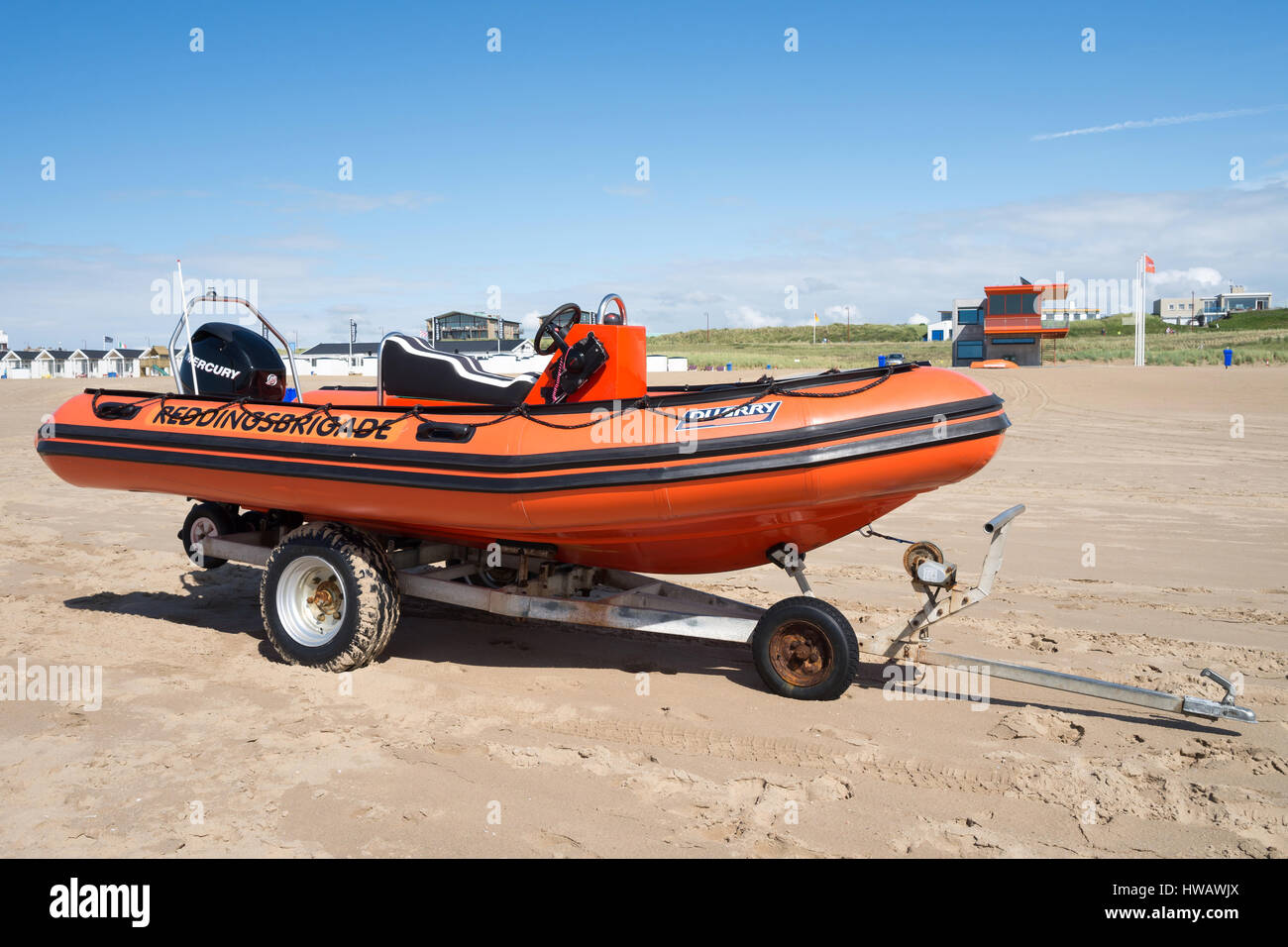 Speedboat of the Dutch lifeguard association at the beach of Katwijk in front of the guardhouse Stock Photo