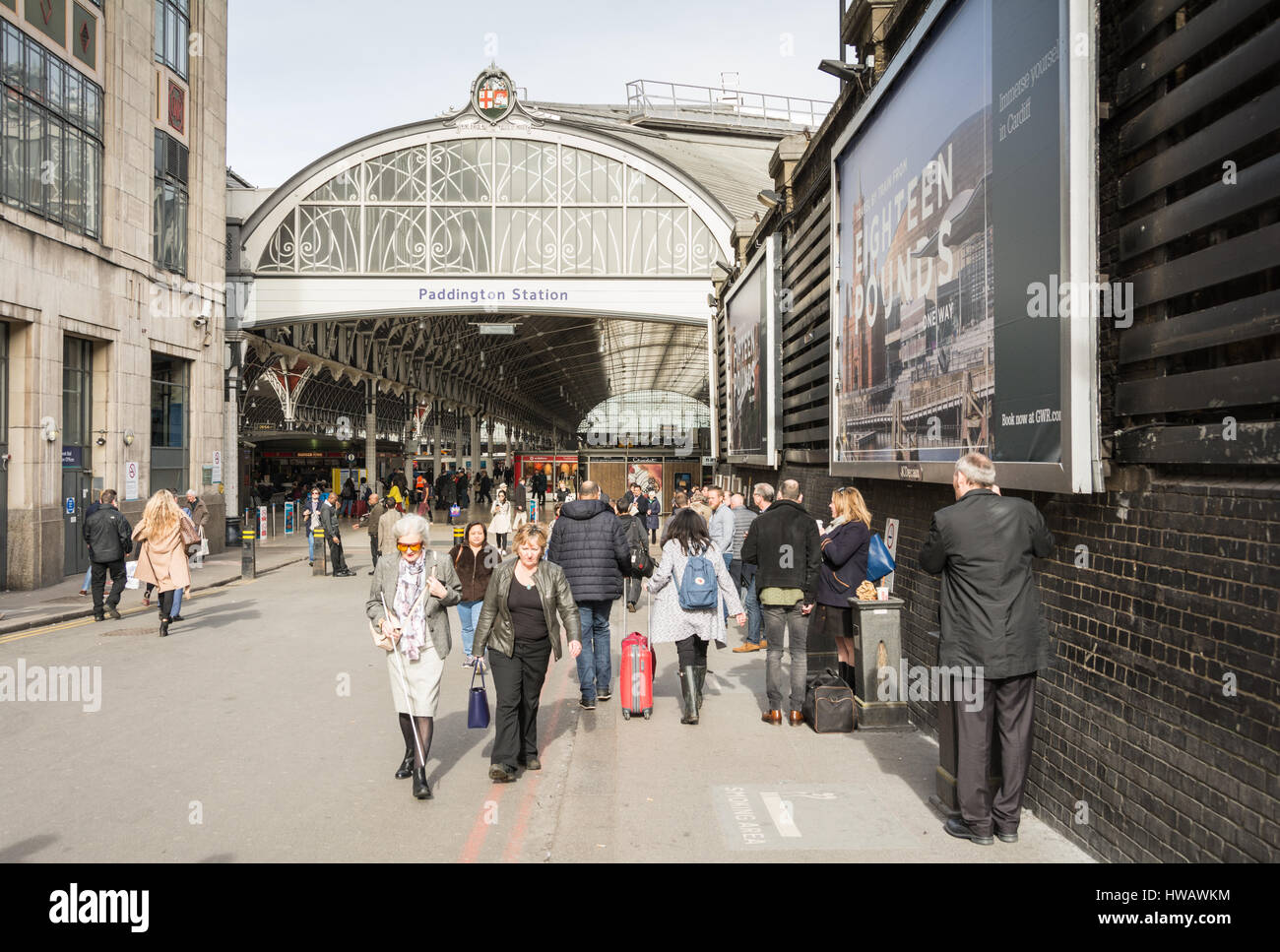 Commuters and travellers at Paddington Station in London, England, UK Stock Photo