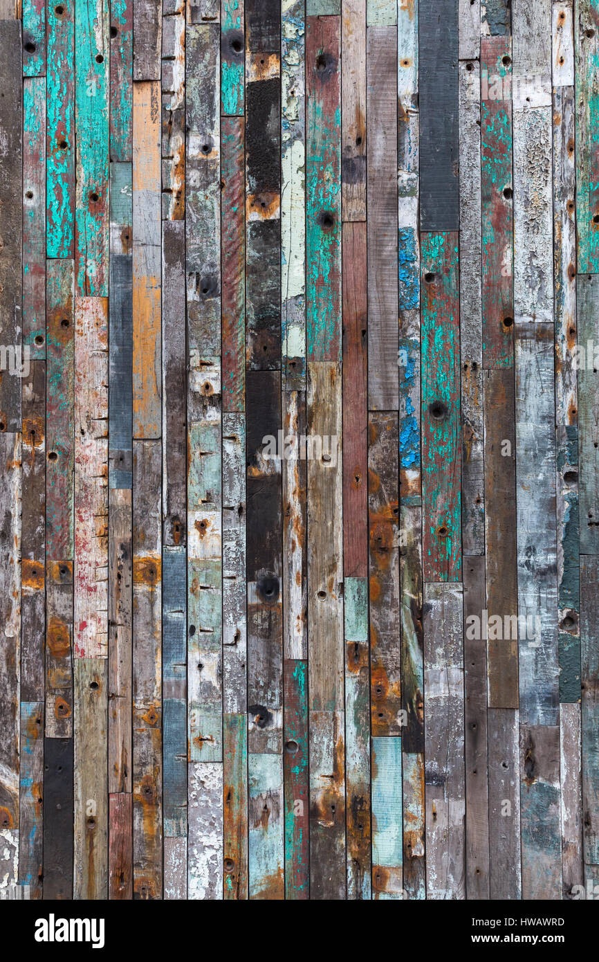 background texture of a wall with different colored old wood planks Stock Photo