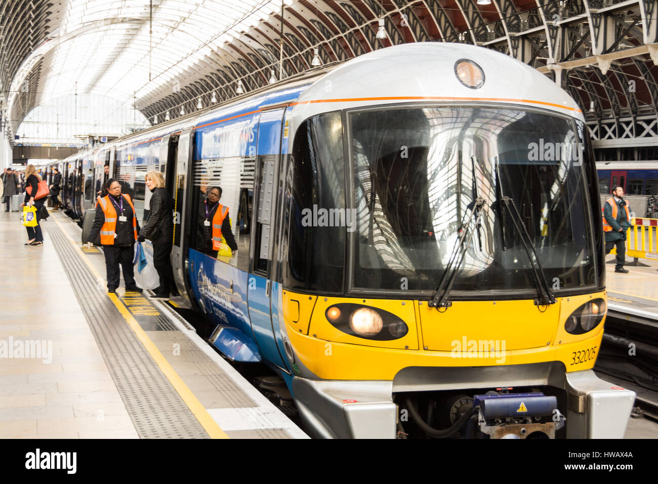 Passengers alighting A Tata Communications Heathrow Express train at Paddington Station, London, England, UK Stock Photo