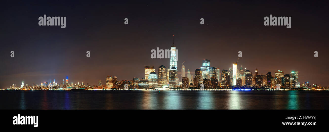 New York City downtown skyline at night panorama over Hudson River ...