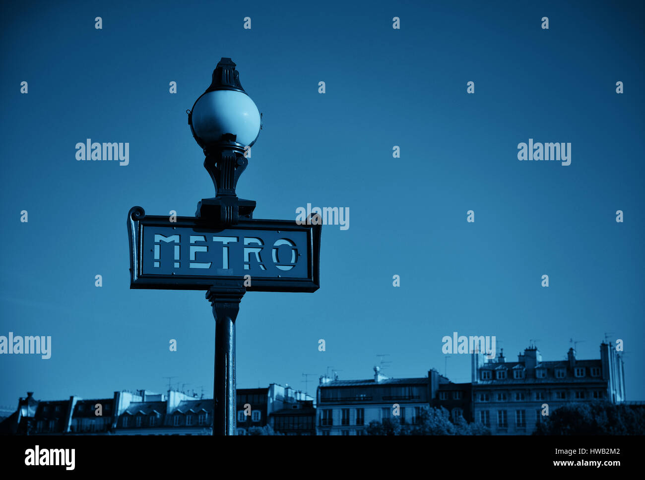 Vintage metro sign in Paris street. Stock Photo