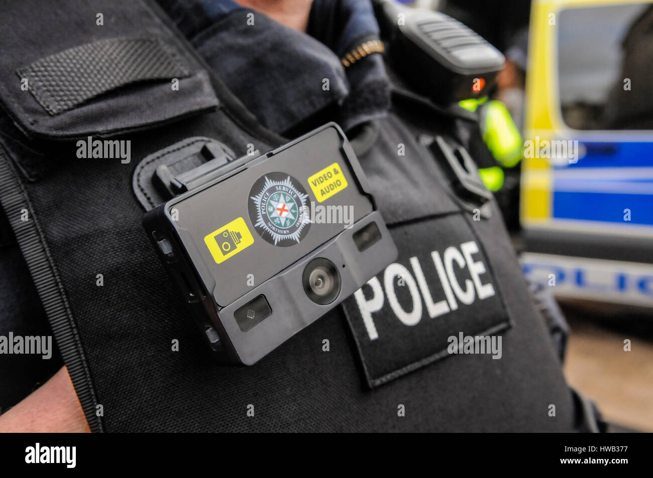 Police officer from the PSNI wears a body cam to record video and audio. Stock Photo
