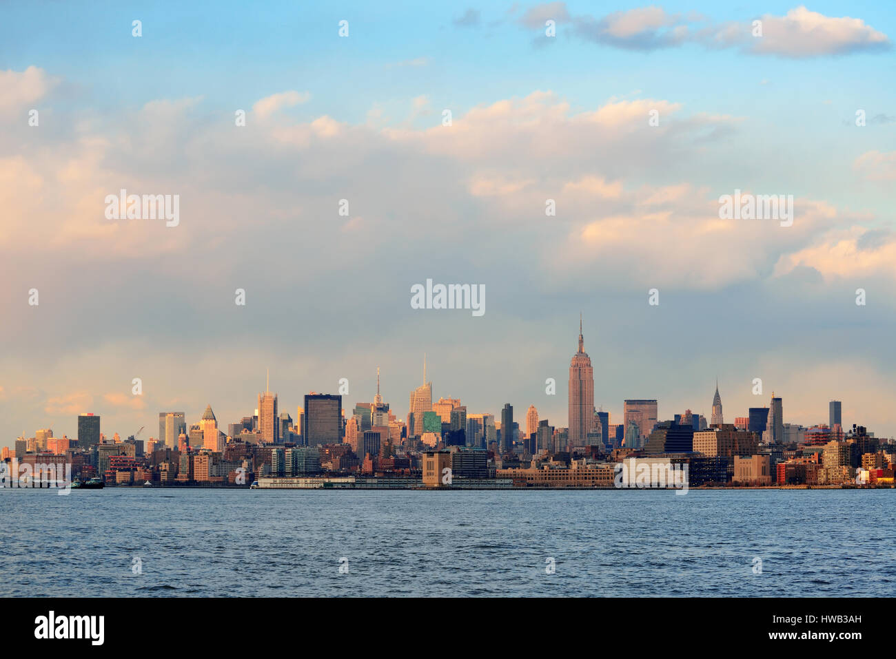 Downtown Manhattan skyline at sunset over Hudson River in New York City ...