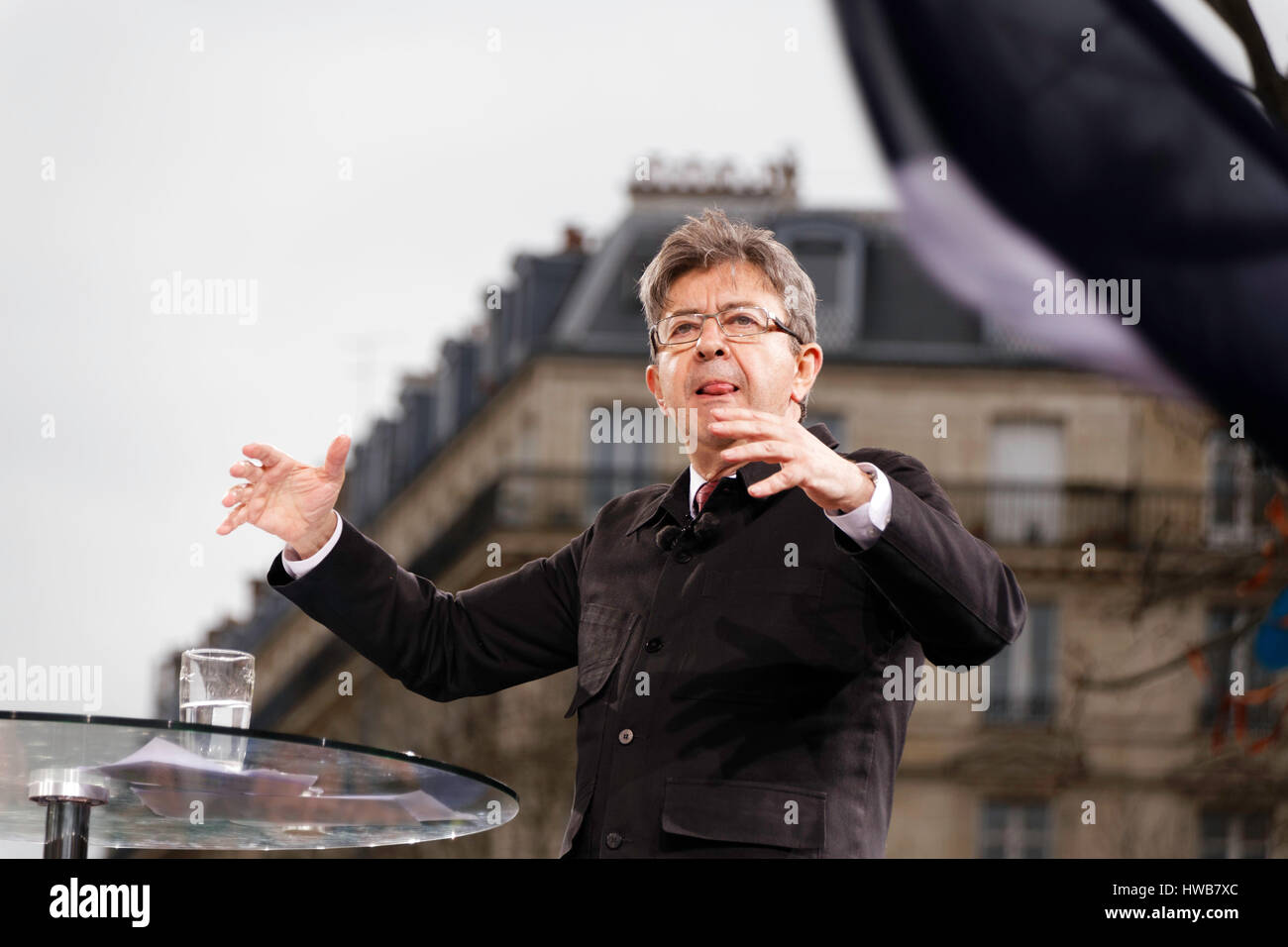 Paris, France. 18th March, 2017. Jean Luc Melenchon, presidential candidate speaks at the arrival of the parade for the 6th republic on the podium of the Place de la République in Paris, France. Credit: Bernard Menigault/Alamy Live News Stock Photo