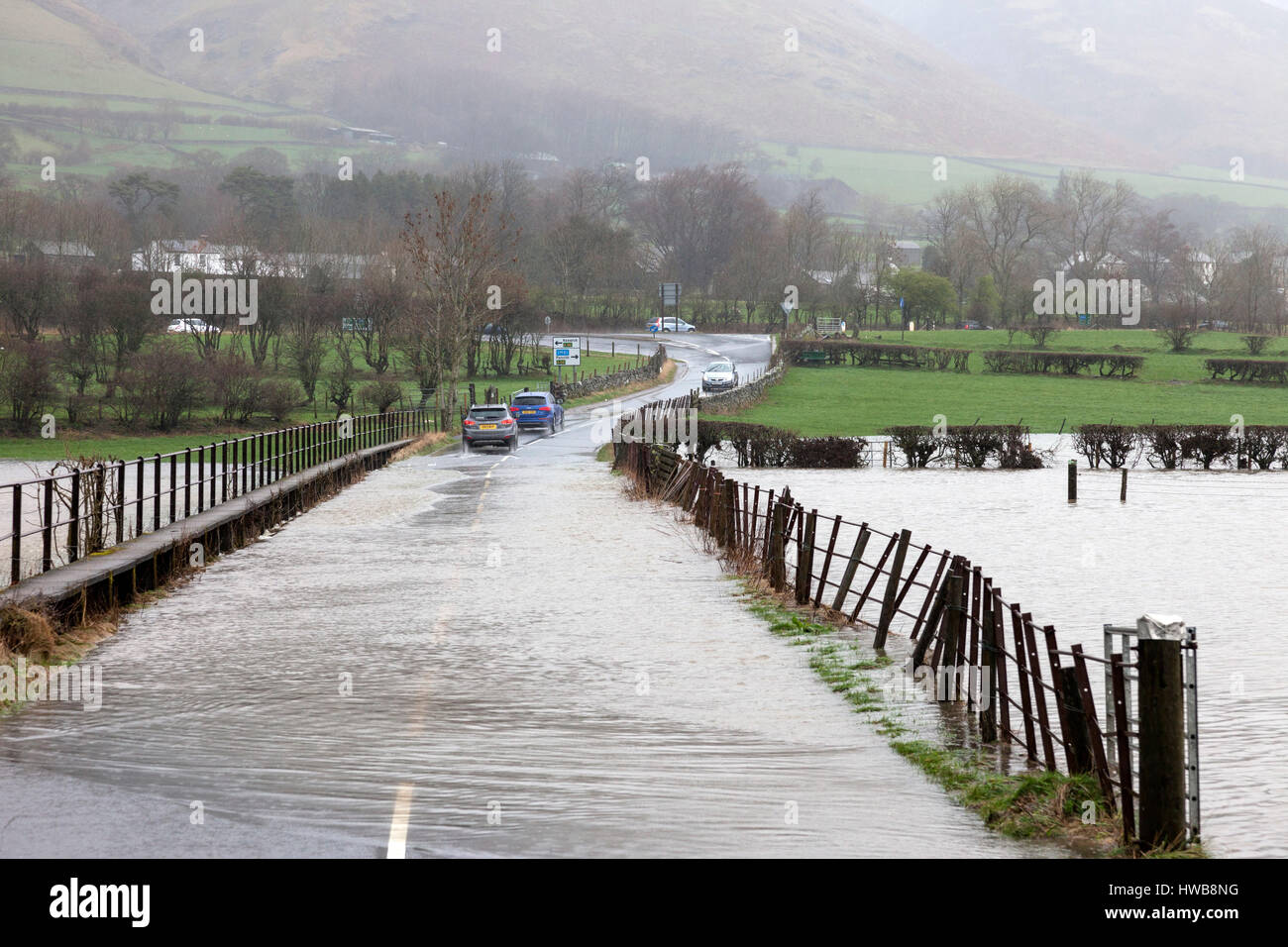 Thelkeld, Lake District, Cumbria UK.  Sunday 19th March 2017.  UK Weather.  Heavy rain has caused flooding in parts of Cumbria today.  This is the B5322 road close to the junction with the A66 near the village of Threlkeld © David Forster/Alamy Live News Stock Photo