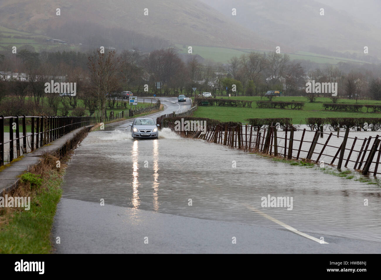 Thelkeld, Lake District, Cumbria UK.  Sunday 19th March 2017.  UK Weather.  Heavy rain has caused flooding in parts of Cumbria today.  This is the B5322 road close to the junction with the A66 near the village of Threlkeld © David Forster/Alamy Live News Stock Photo