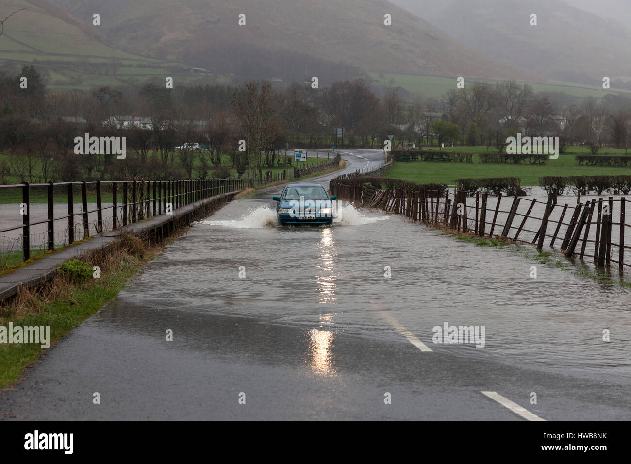 Thelkeld, Lake District, Cumbria UK.  Sunday 19th March 2017.  UK Weather.  Heavy rain has caused flooding in parts of Cumbria today.  This is the B5322 road close to the junction with the A66 near the village of Threlkeld © David Forster/Alamy Live News Stock Photo
