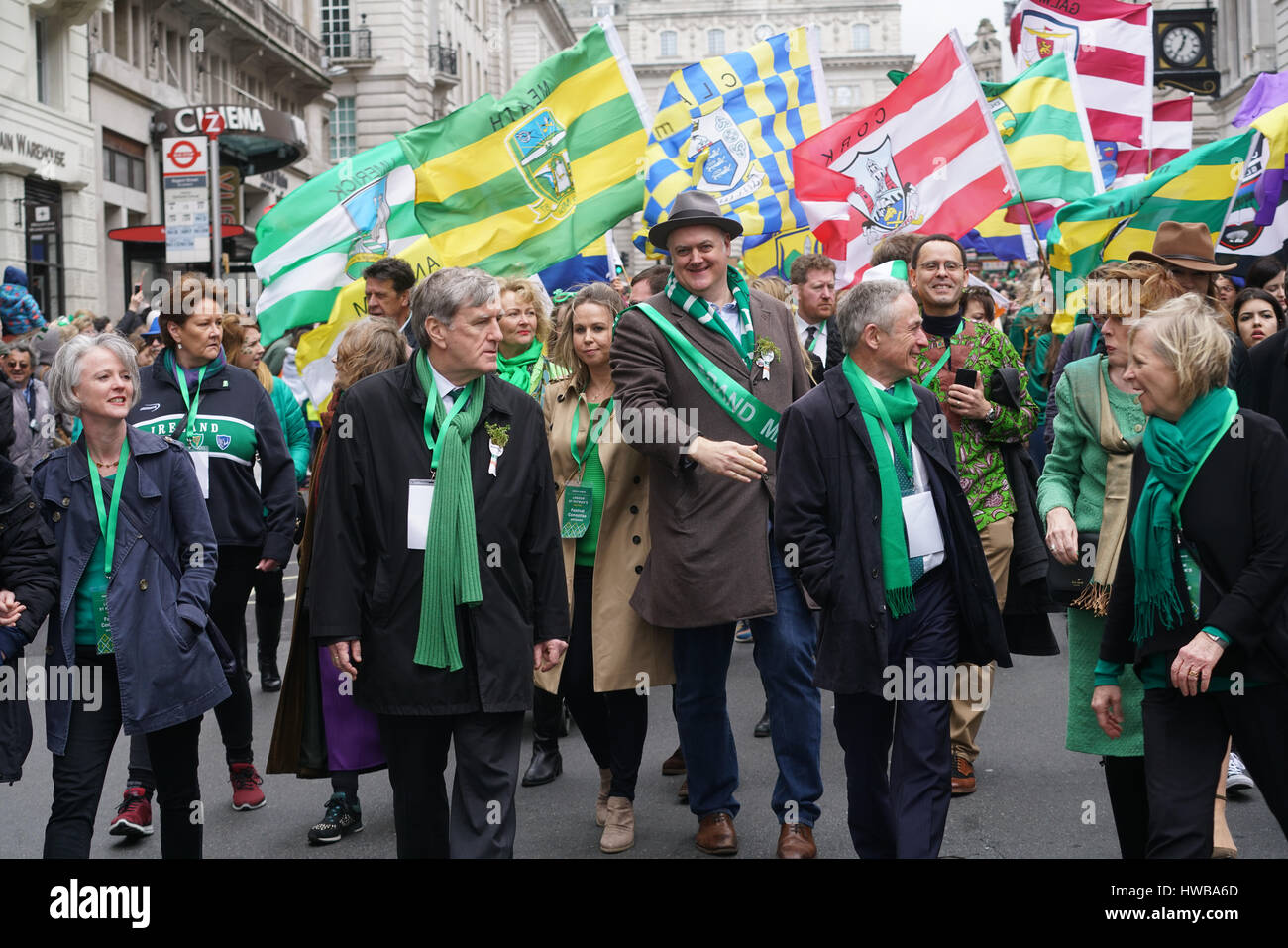 London, UK. 19th March, 2017. Dan Mulhall, Irish Ambassador, Dara O’Briain and Richard Bruton TD, Minister for Education and Skills  join the parade the London’s St Patrick’s in London on 19th March 2017. Credit: See Li/Alamy Live News Stock Photo