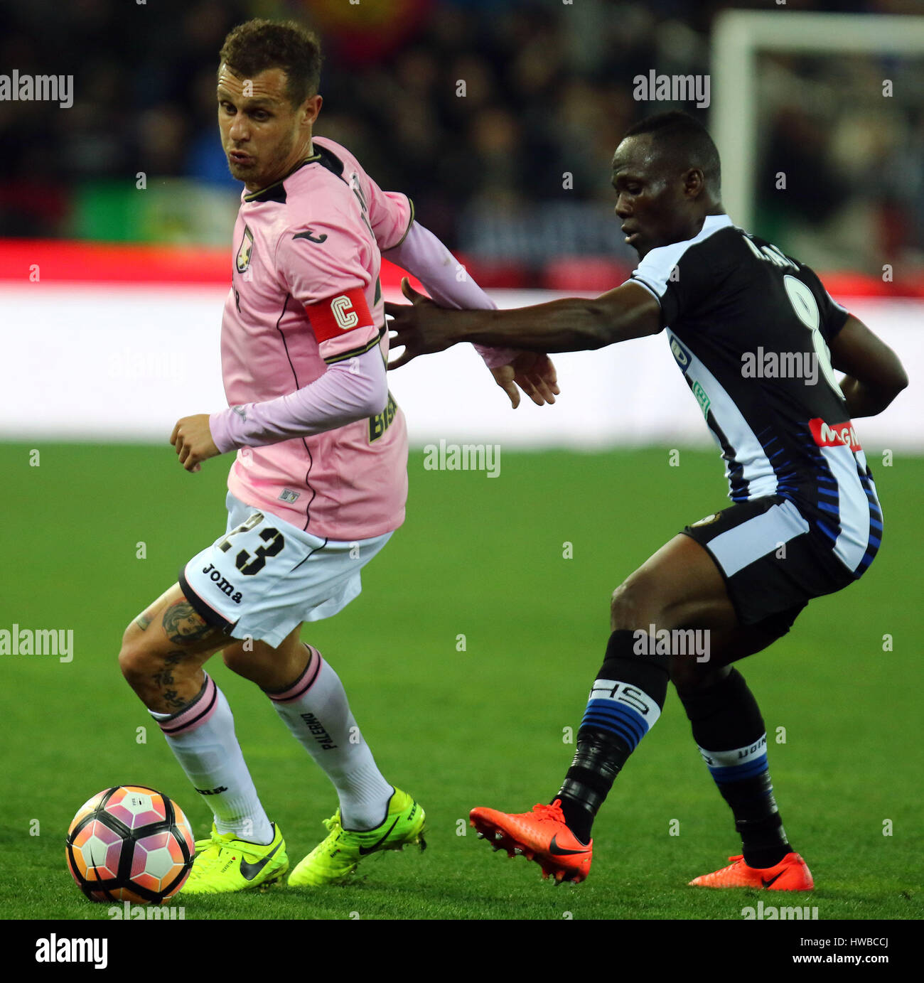 Udine, Italy. 19th March, 2017. Palermo's midfielder Alessandro Diamanti (L) vies with Udinese's midfielder Emmanuel Agyemang Badu (R) during the Serie A football match between Udinese Calcio v US Citta di Palermo at Dacia Arena Stadium on 19th March, 2017. Credit: Andrea Spinelli/Alamy Live News Stock Photo