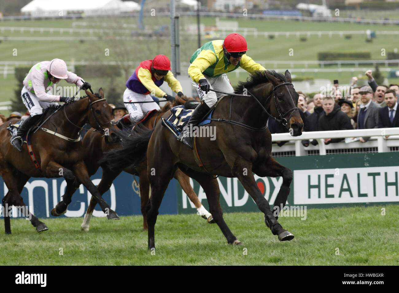 17.03.2017 - Cheltenham; Sizing John (yellow-green) ridden by Robbie Power wins the Timico Cheltenham Gold Cup Chase (Grade 1) at Cheltenham-Racecourse/Great Britain. Credit: Lajos-Eric Balogh/turfstock.com Stock Photo