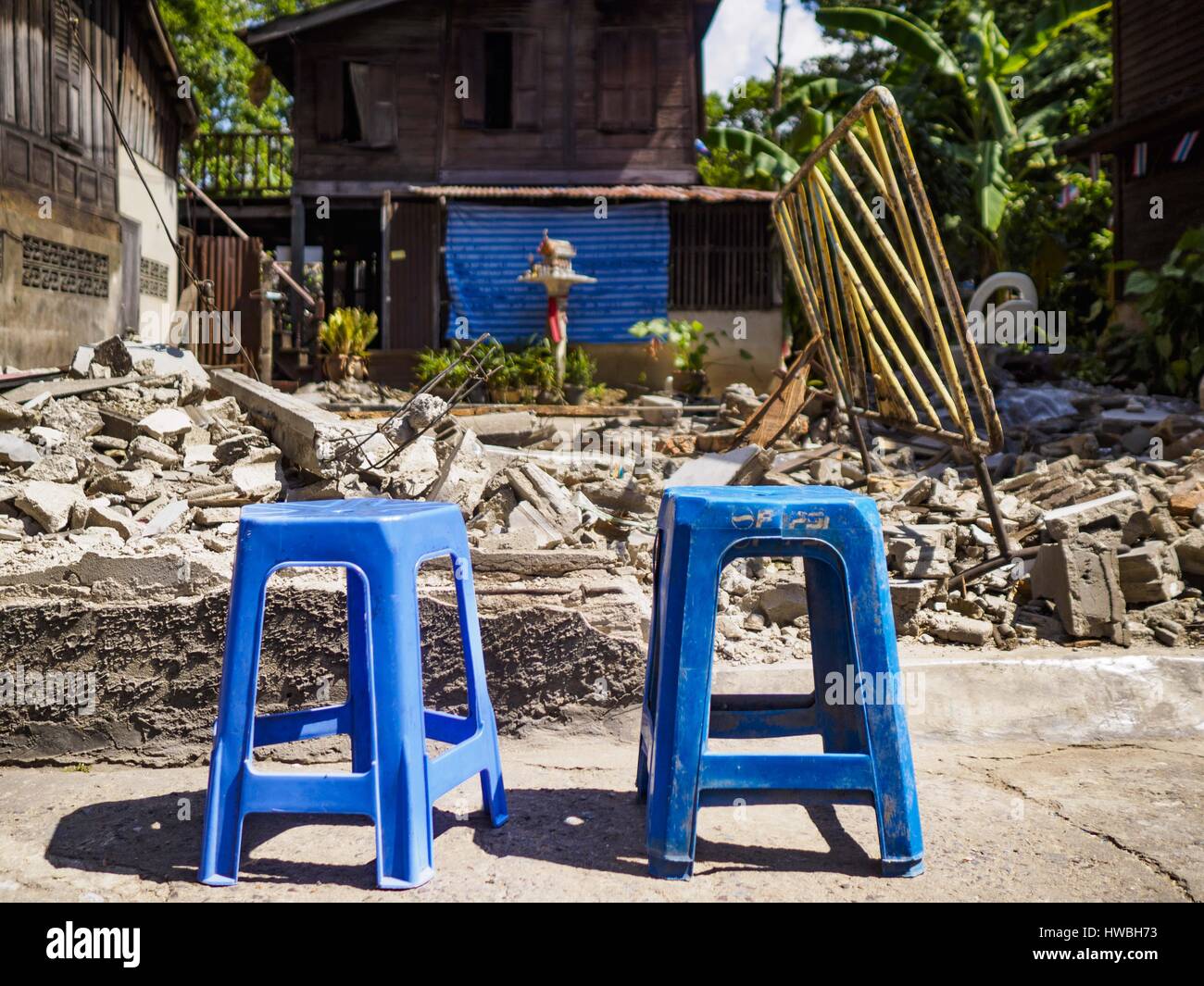 Bangkok, Bangkok, Thailand. 20th Mar, 2017. Plastic stools in front of an empty lot that used to be a home in Pom Mahakan. As families are evicted the government immediately tears down the home so squatters don't move into it. The final evictions of the remaining families in Pom Mahakan, a slum community in a 19th century fort in Bangkok, have started. City officials are moving the residents out of the fort. NGOs and historic preservation organizations protested the city's action but city officials did not relent and started evicting the remaining families in early March. (Credit Image: © Ja Stock Photo