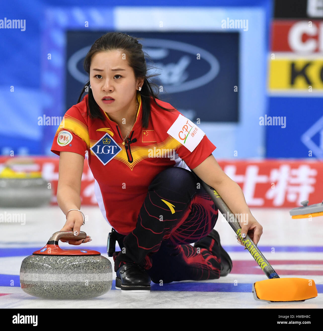 Beijing, China. 20th Mar, 2017. Wang Rui of China delivers a stone ...