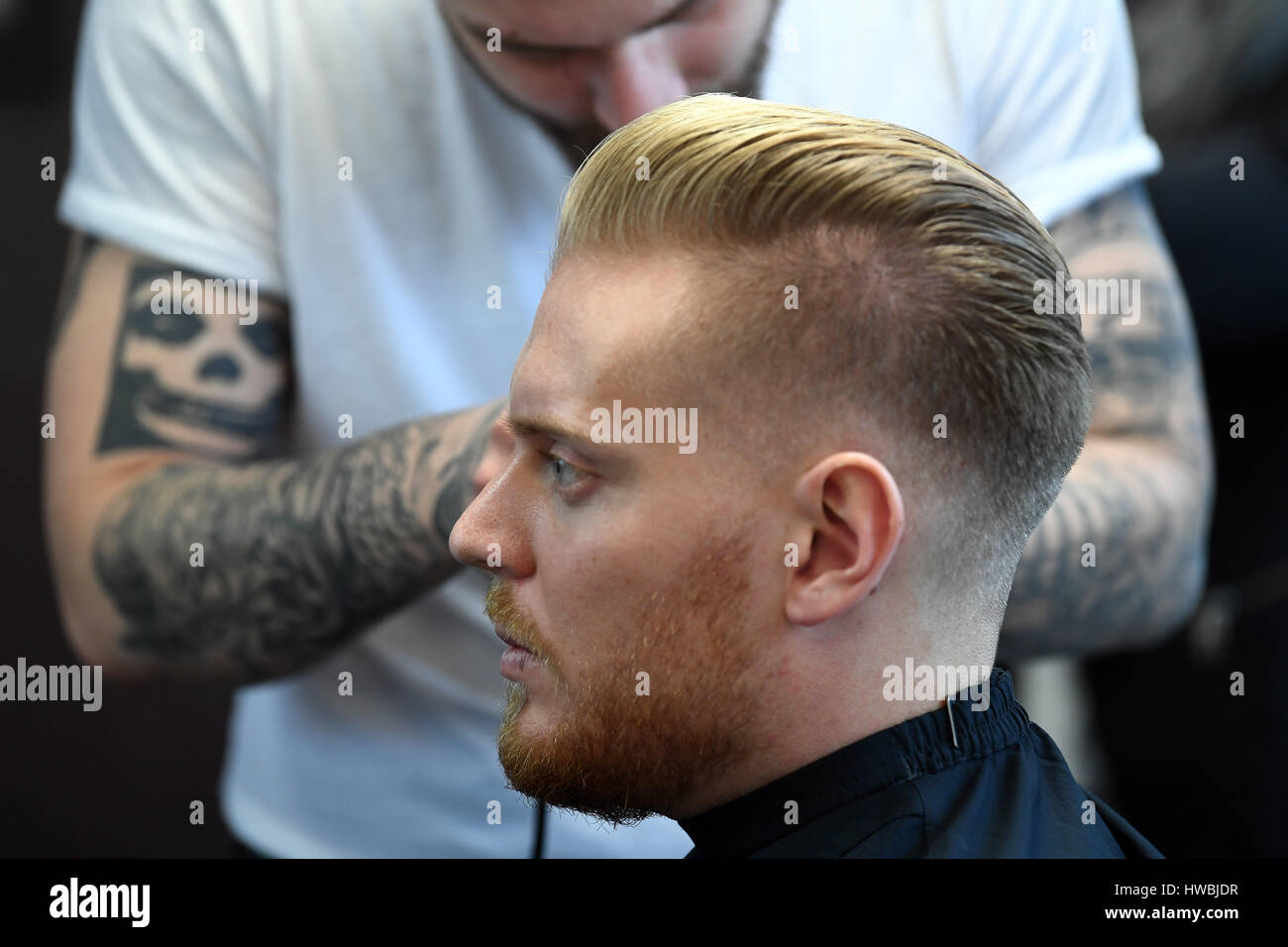 Duesseldorf, Germany. 20th Mar, 2017. Models Johann gets a new hairstyle at  the Top Hair hairdressing exposition press conference in Duesseldorf,  Germany, 20 March 2017. The latest trends will be shown at