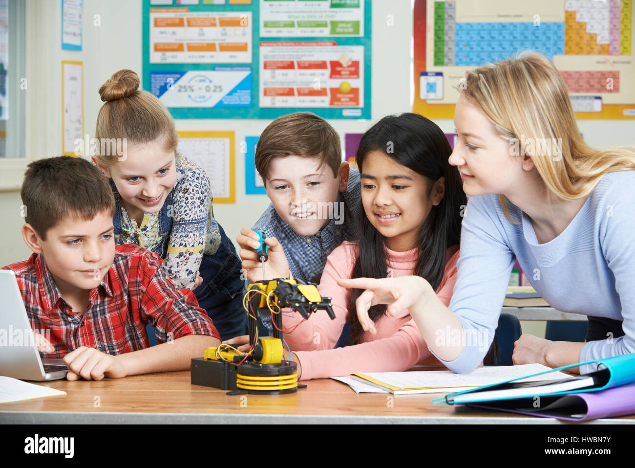 Pupils And Teacher In Science Lesson Studying Robotics Stock Photo