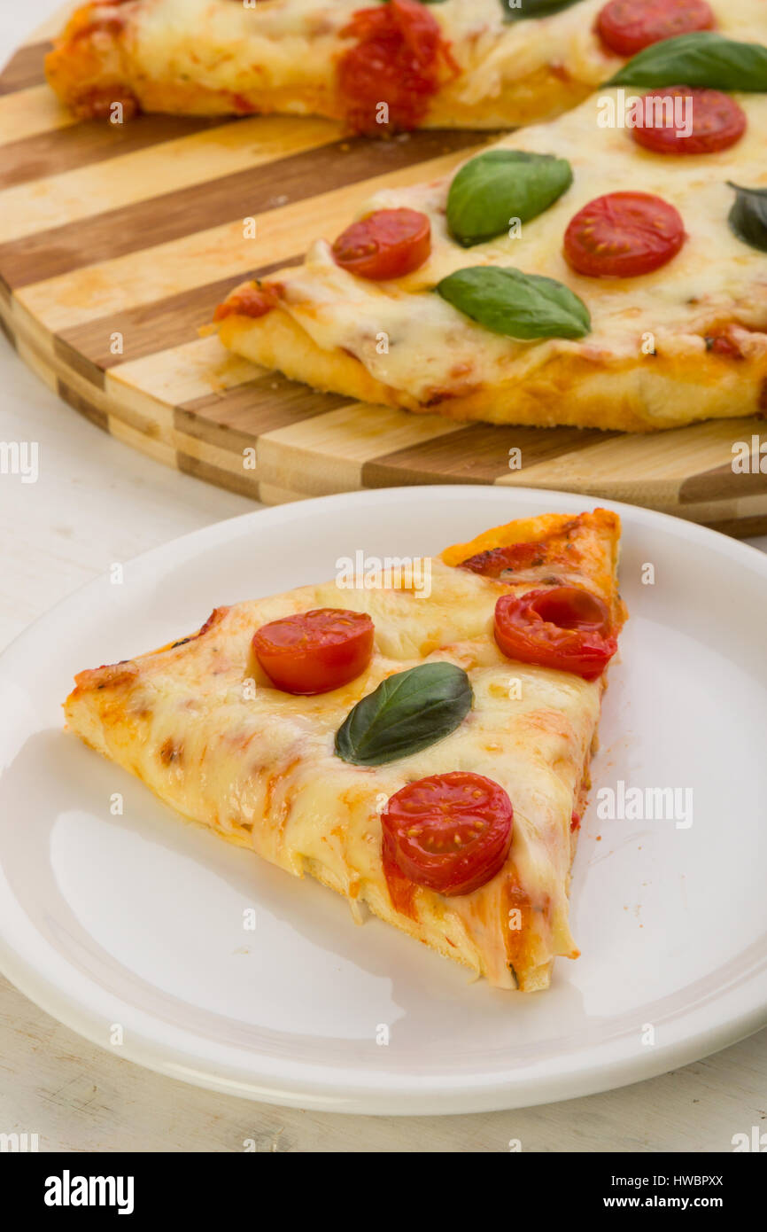 classic pizza margherita slice on white plate Stock Photo Alamy